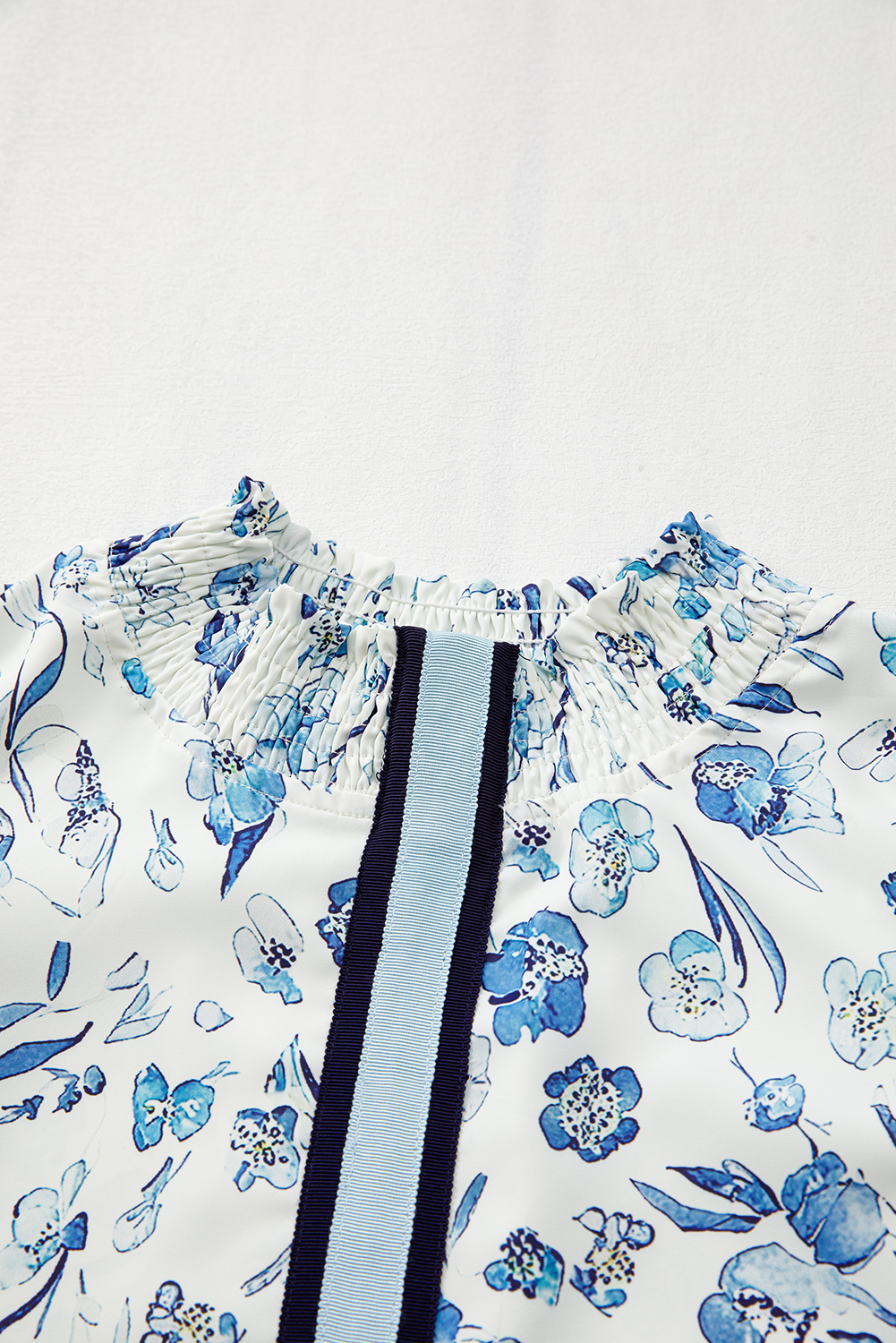 Chic Floral Blouse with Smocked Neckline and Ruffled Sleeves for Everyday Wear - Detail View 10 Chic Floral Blouse with Smocked Neckline and Ruffled Sleeves for Everyday Wear - Detail View 10