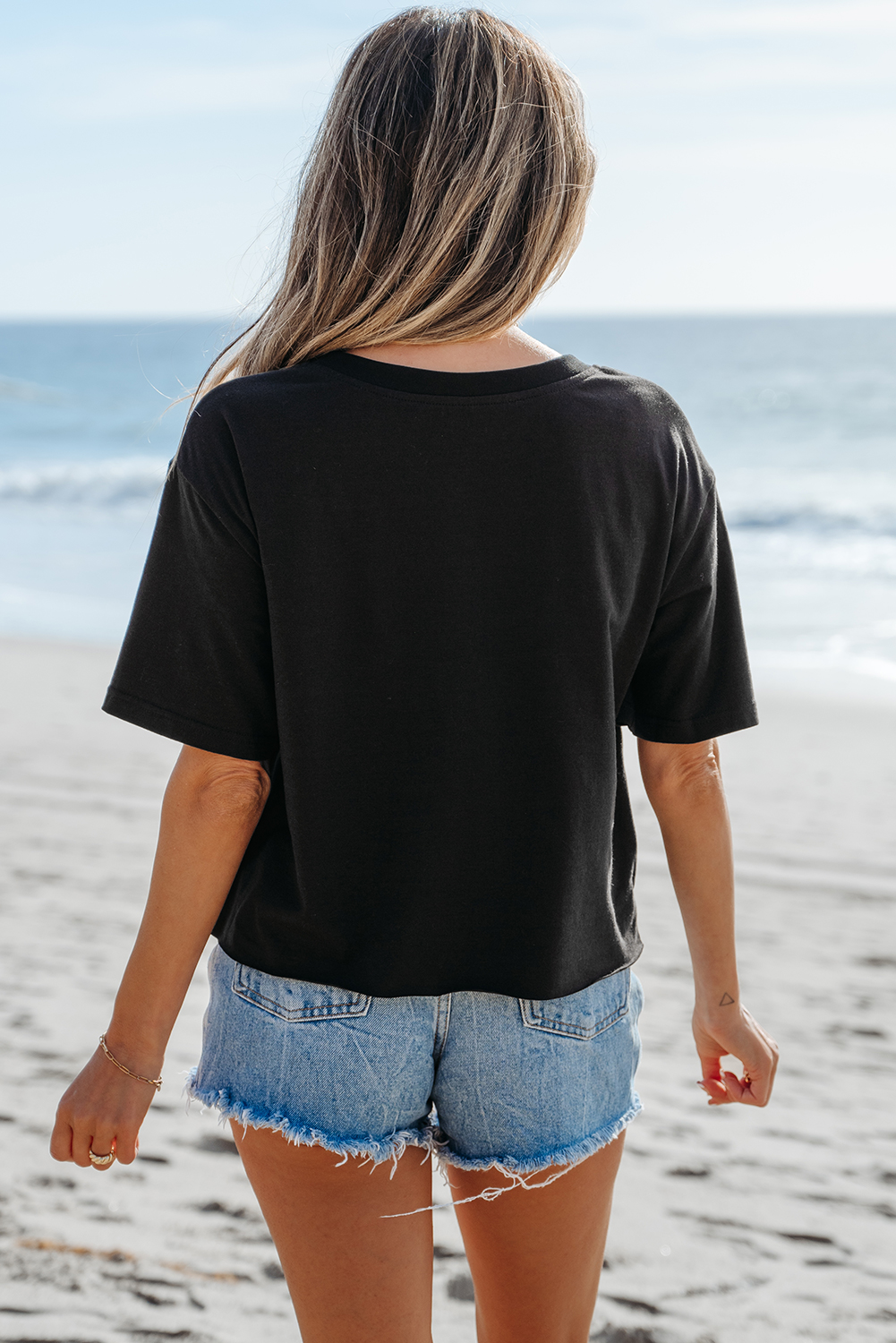 Stylish Black Round Neck Tee with Checkerboard and Peace Sign Design - Detail View 2 Stylish Black Round Neck Tee with Checkerboard and Peace Sign Design - Detail View 2