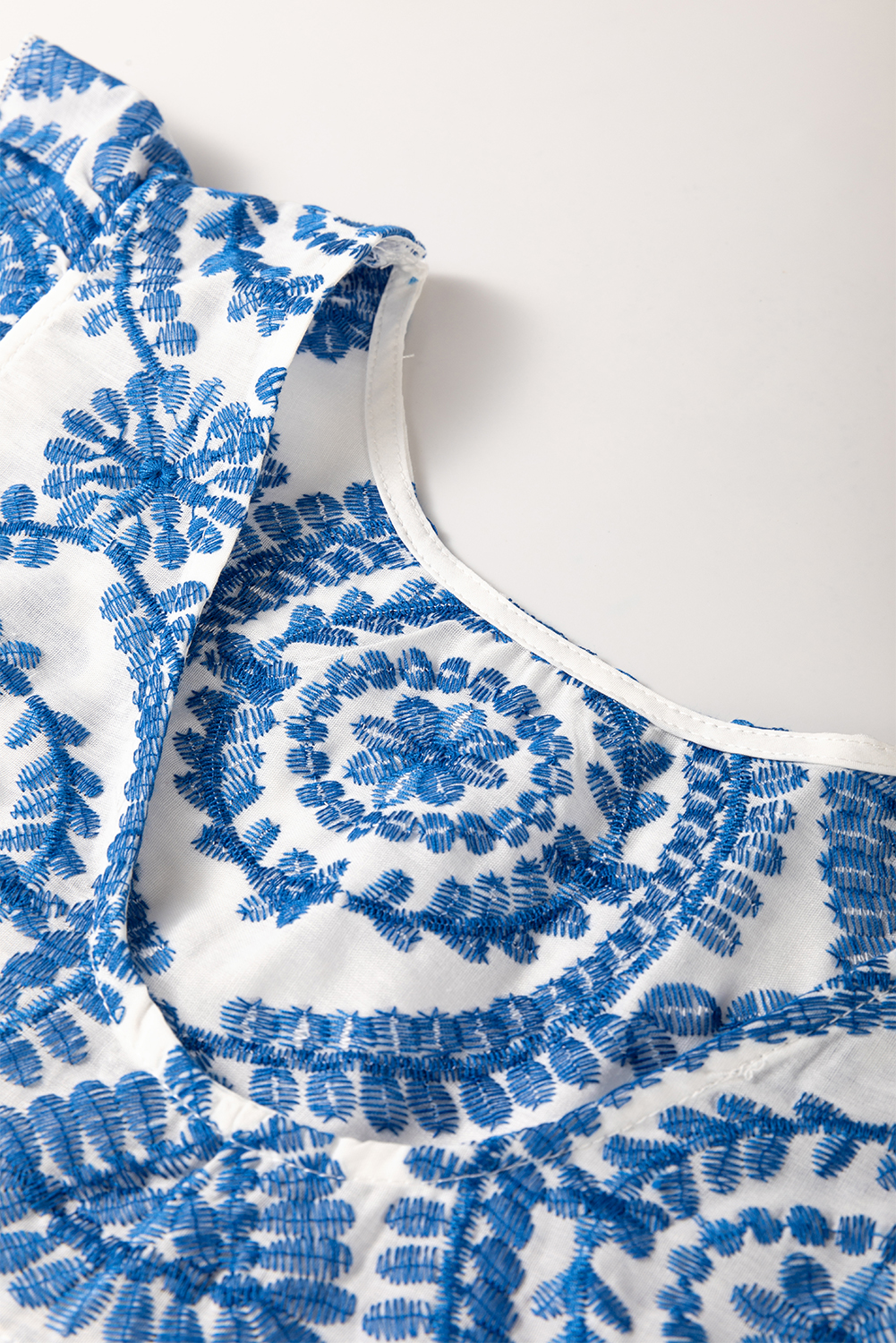 Stylish and Versatile Blue Flutter Sleeve Blouse with Bohemian Print - Detail View 6 Stylish and Versatile Blue Flutter Sleeve Blouse with Bohemian Print - Detail View 6