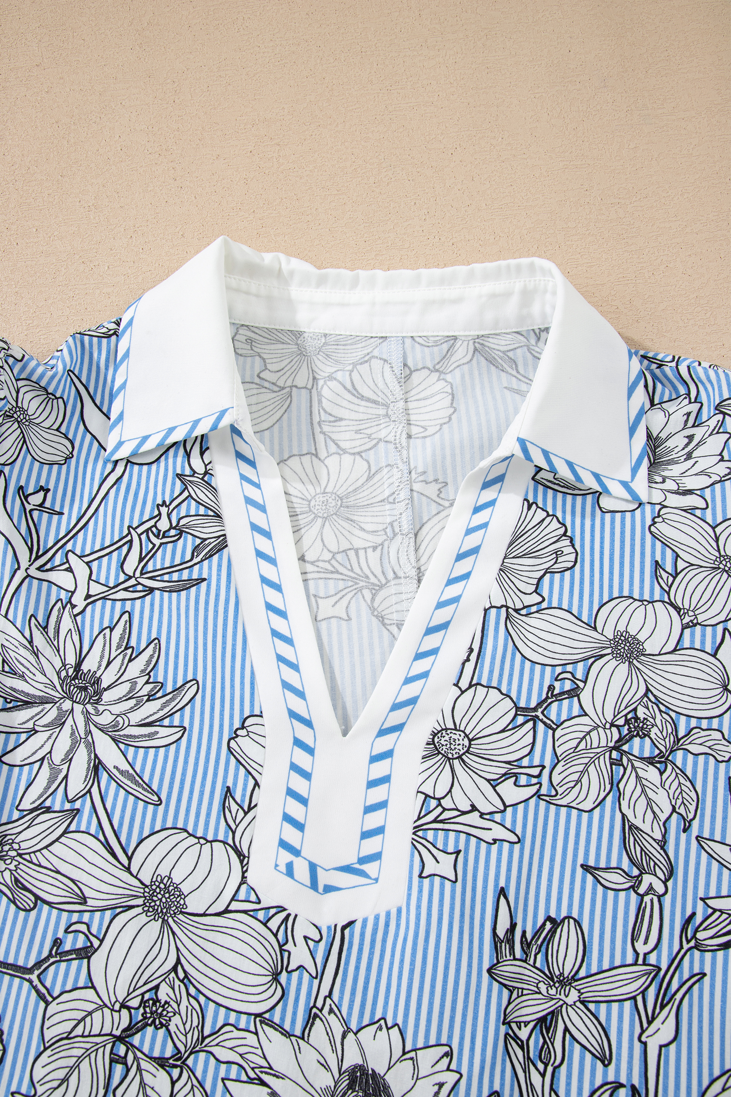 Chic Sky Blue Floral Polo Collar Blouse – Perfect Short Sleeve Top for Summer Vacations - Detail View 6 Chic Sky Blue Floral Polo Collar Blouse – Perfect Short Sleeve Top for Summer Vacations - Detail View 6