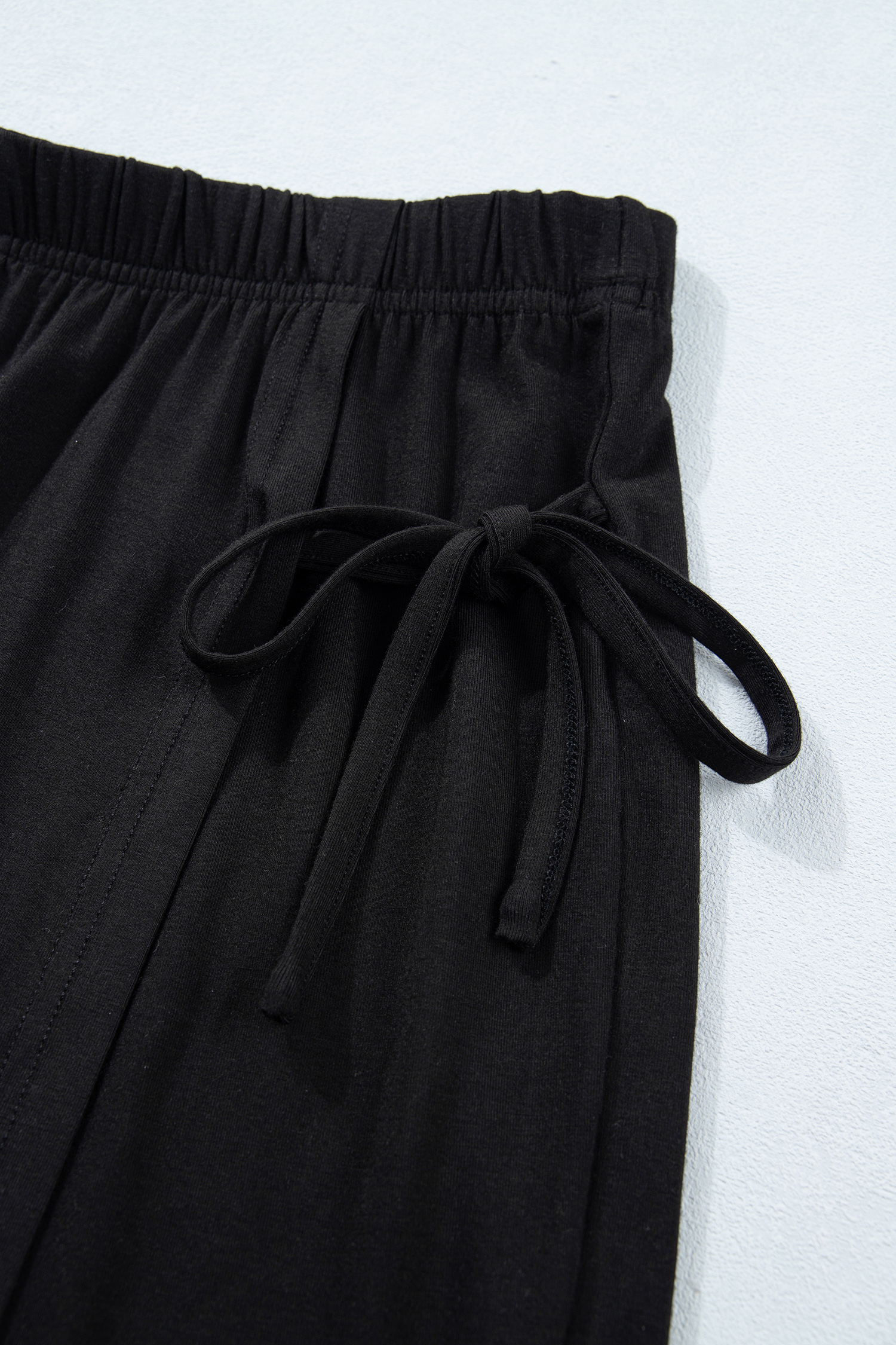 Women's Casual Office Ensemble – Solid Black Oversized T-Shirt and Mini Wrap Skort, 2-Piece Set - Detail View 11 Women's Casual Office Ensemble – Solid Black Oversized T-Shirt and Mini Wrap Skort, 2-Piece Set - Detail View 11