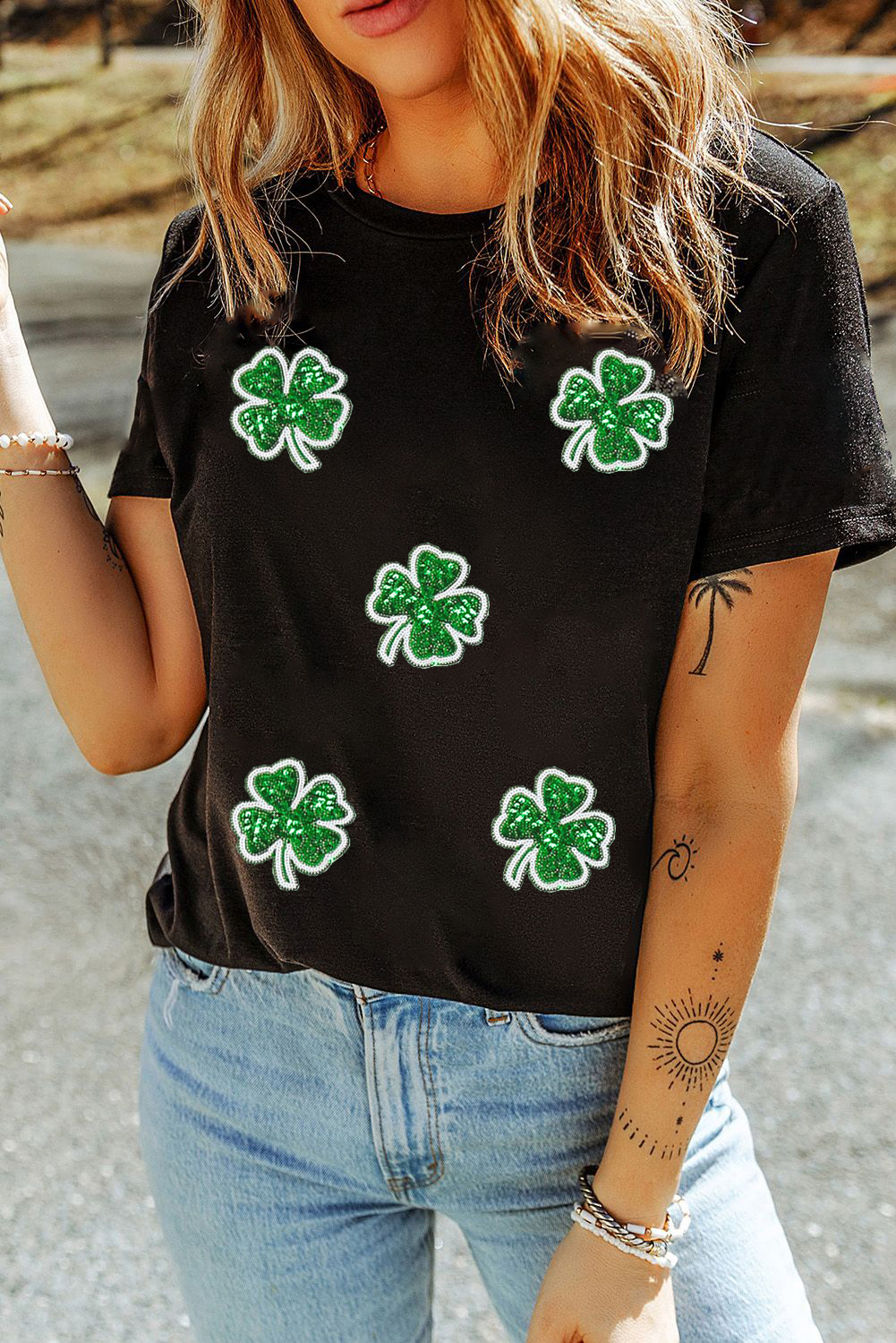 Festive St. Patrick's Day Black Graphic T-Shirt with Four Leaf Clover Design - Detail View 2 Festive St. Patrick's Day Black Graphic T-Shirt with Four Leaf Clover Design - Detail View 2