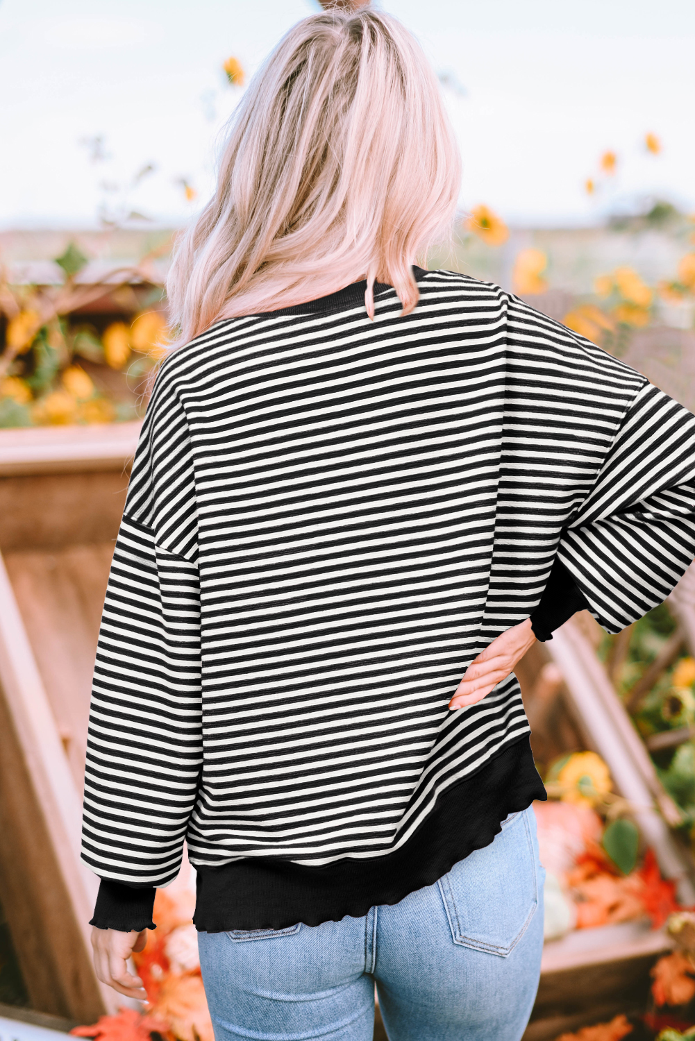 Chic Drop Shoulder Black Stripe Top with Nutcracker Doll Sequin Design - Detail View 2 Chic Drop Shoulder Black Stripe Top with Nutcracker Doll Sequin Design - Detail View 2
