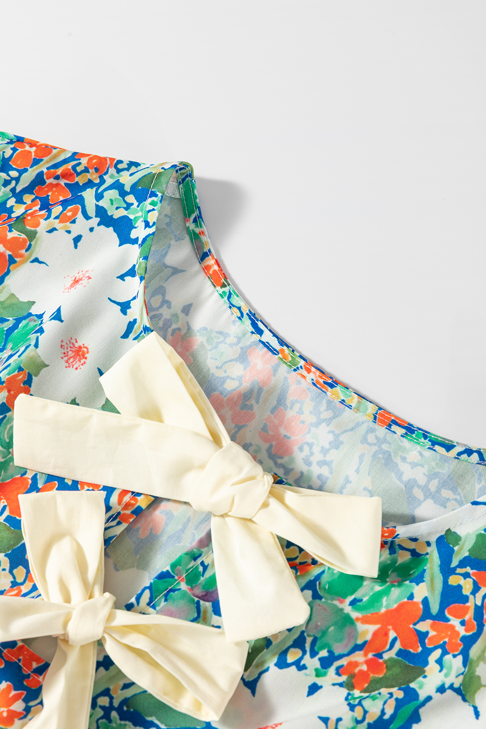 Women's Green Floral Print Bow Applique Sleeveless Peplum Blouse for Summer - Detail View 9 Women's Green Floral Print Bow Applique Sleeveless Peplum Blouse for Summer - Detail View 9