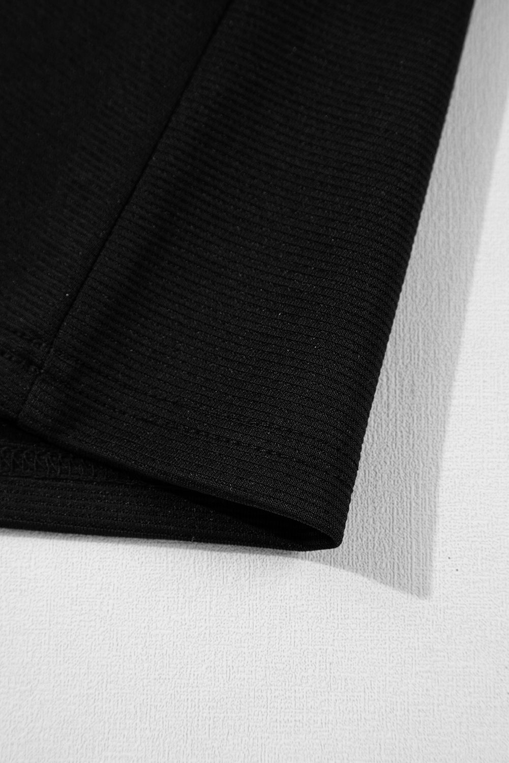 Chic and Elegant Black Mini Dress with Slit Neck and Sleeveless Design - Detail View 18 Chic and Elegant Black Mini Dress with Slit Neck and Sleeveless Design - Detail View 18