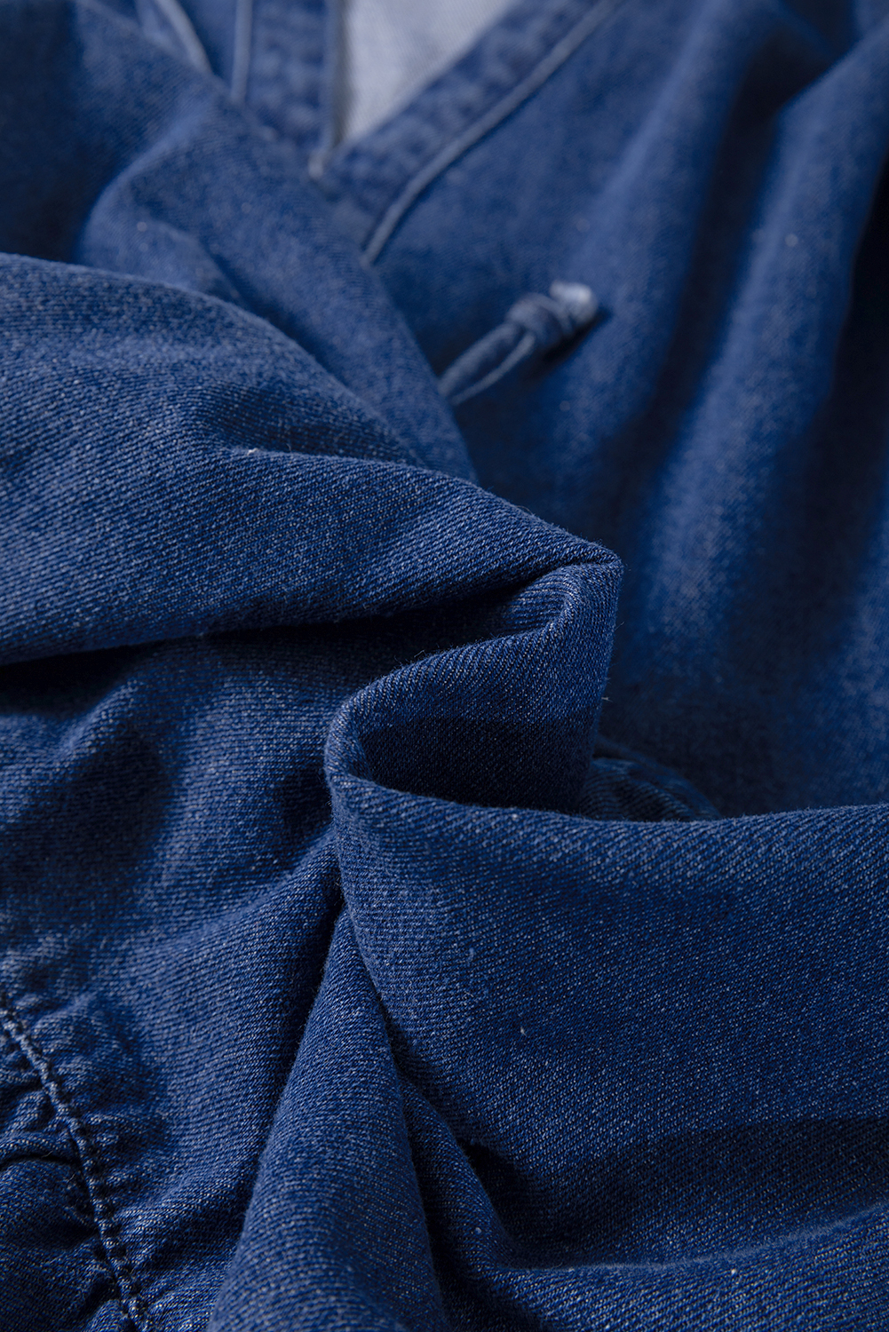 Versatile Blue Denim Mini Dress with Ruffle Details and V Neck for Daily Wear - Detail View 11 Versatile Blue Denim Mini Dress with Ruffle Details and V Neck for Daily Wear - Detail View 11