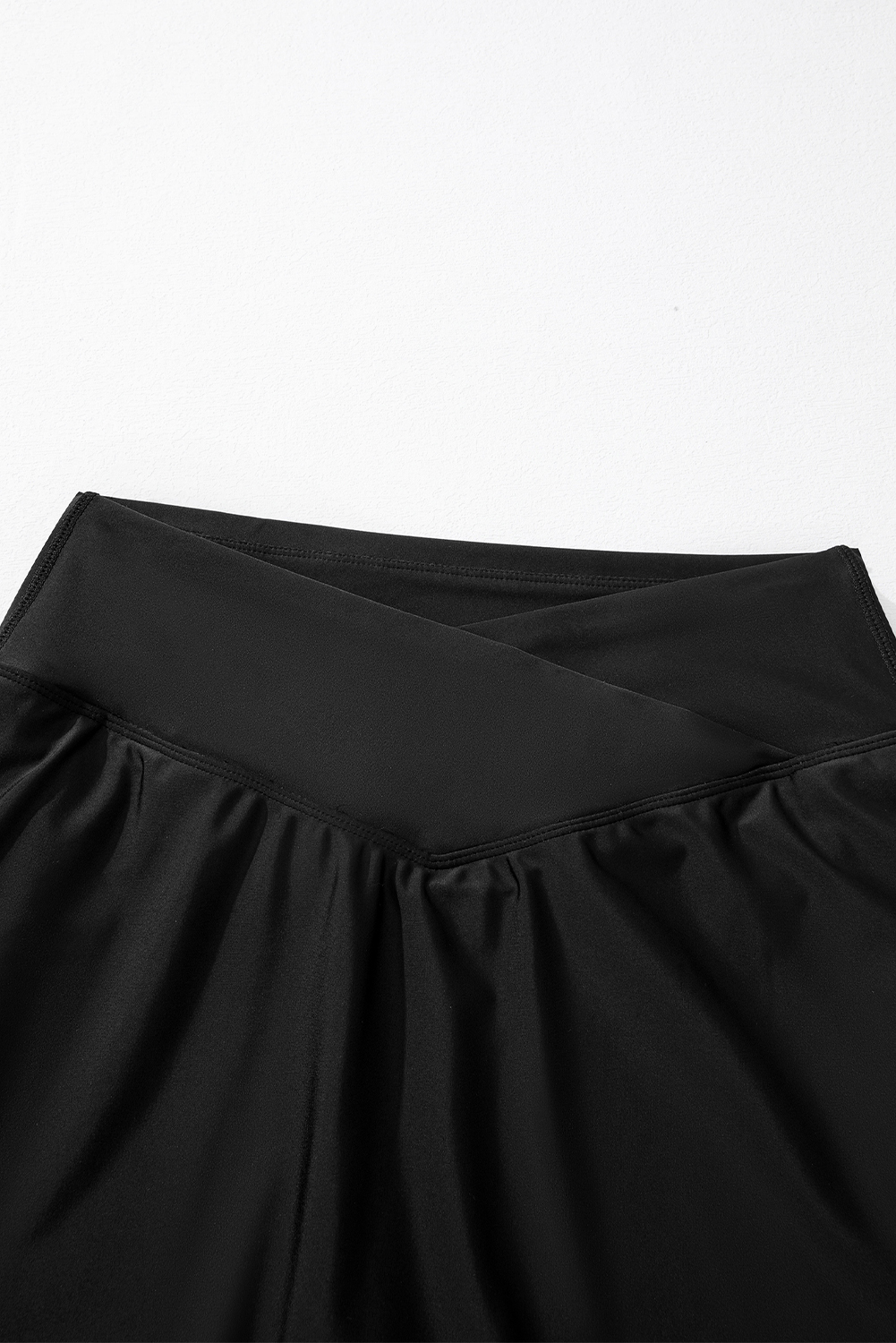 Women's Black Solid Pocketed Crossover High Waist Swim Skort - Detail View 17 Women's Black Solid Pocketed Crossover High Waist Swim Skort - Detail View 17