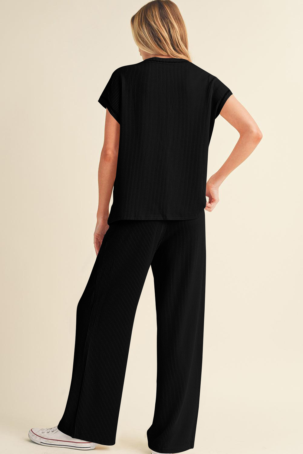Chic Black Two-Piece Set: Corded Short Sleeve Top with High Waist Wide Leg Pants - Detail View 2 Chic Black Two-Piece Set: Corded Short Sleeve Top with High Waist Wide Leg Pants - Detail View 2