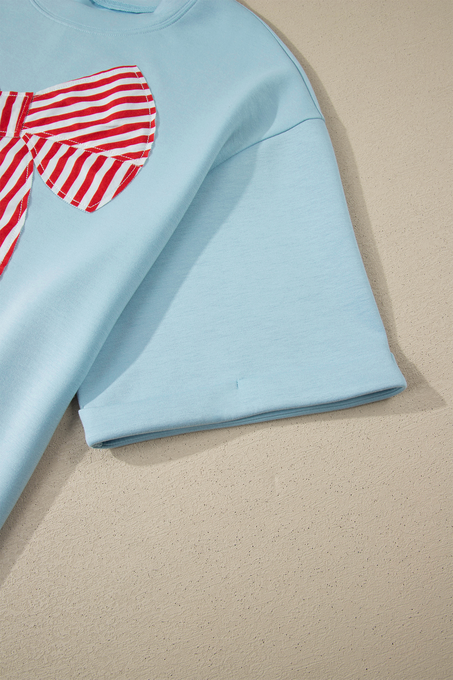 Summer Flag Graphic Tee for Women – Beau Blue Short Sleeve Shirt with Large Bow Detail - Detail View 6 Summer Flag Graphic Tee for Women – Beau Blue Short Sleeve Shirt with Large Bow Detail - Detail View 6