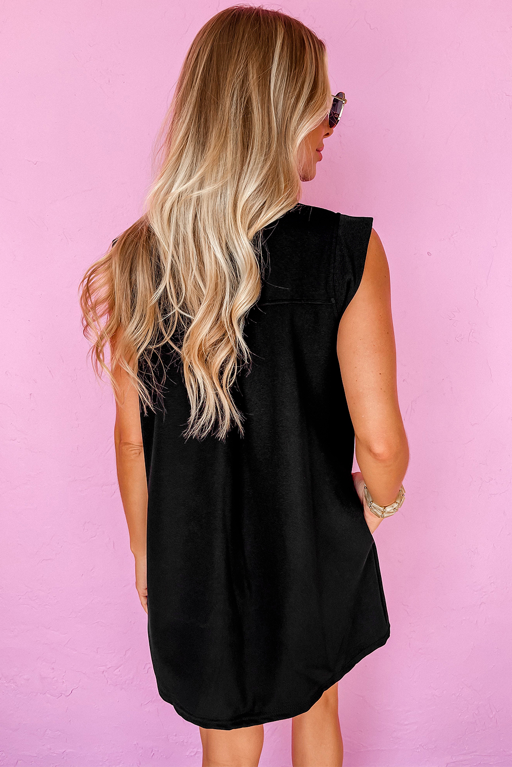 Chic and Elegant Black Mini Dress with Slit Neck and Sleeveless Design - Detail View 2 Chic and Elegant Black Mini Dress with Slit Neck and Sleeveless Design - Detail View 2