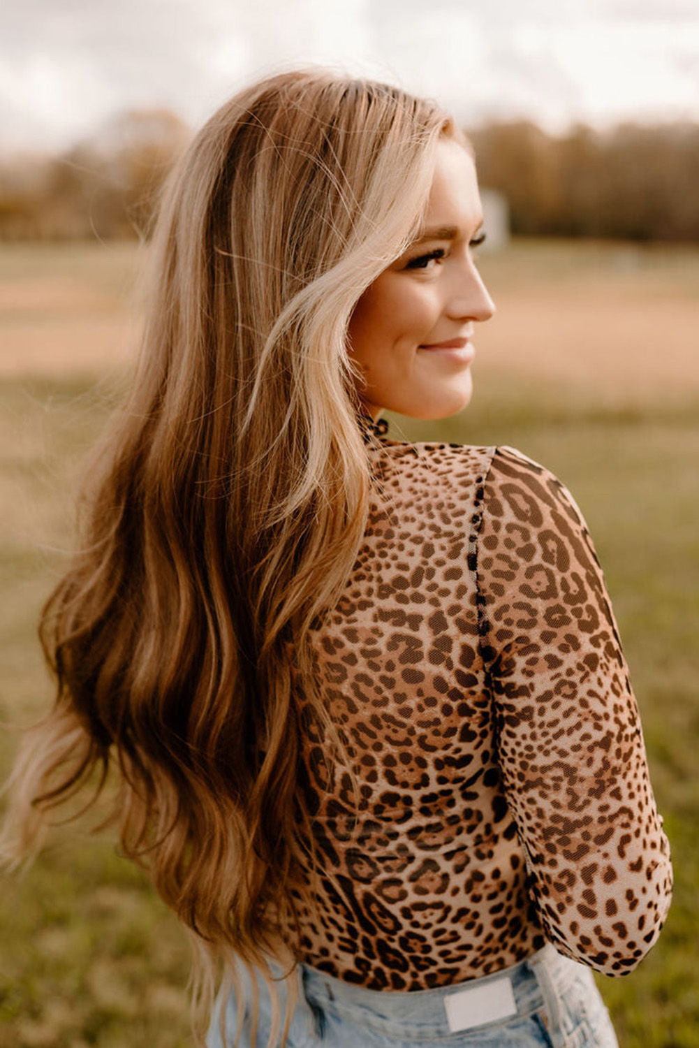 Elegant Leopard Print Bodysuit with Smocked Neck and Long Sleeves for Stylish Looks - Detail View 6 Elegant Leopard Print Bodysuit with Smocked Neck and Long Sleeves for Stylish Looks - Detail View 6