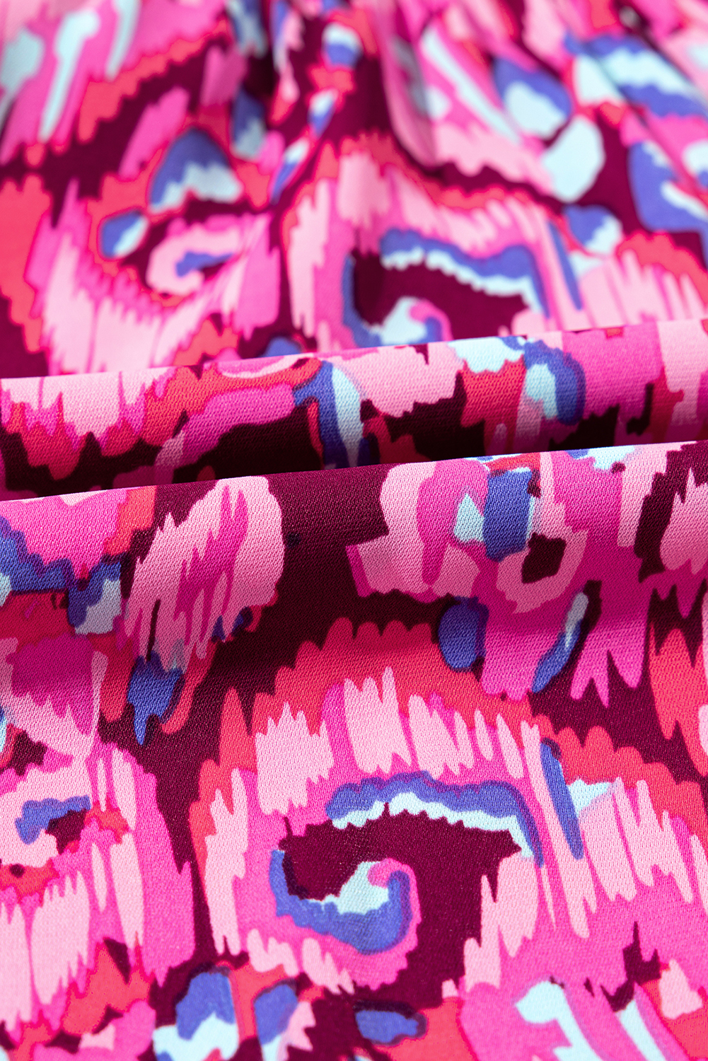 Chic and Comfortable Pink Abstract Print Romper with Puff Sleeves and V Neckline - Detail View 10 Chic and Comfortable Pink Abstract Print Romper with Puff Sleeves and V Neckline - Detail View 10