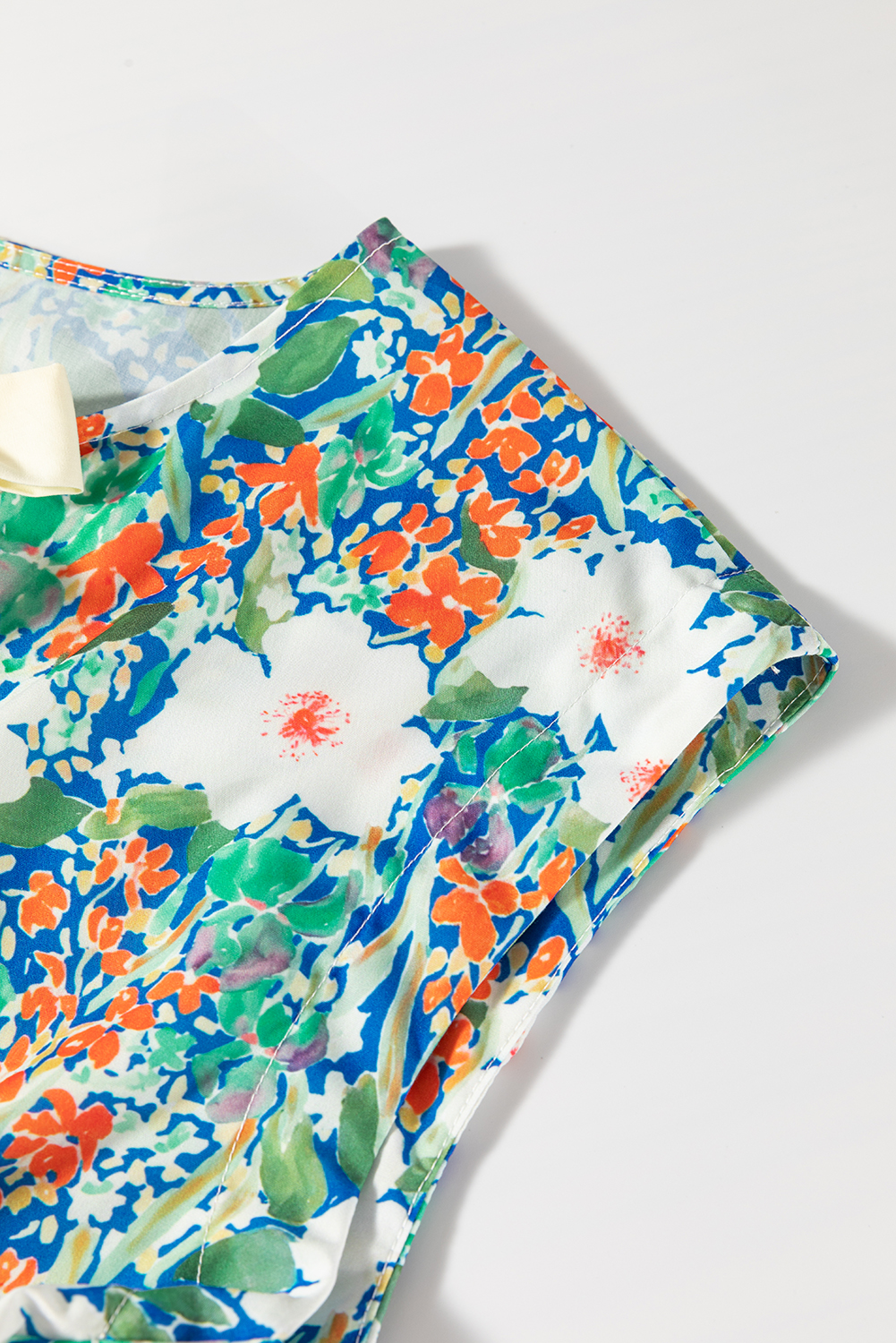Flattering Green Floral Peplum Top - Perfect for Daily Wear and Warm Weather - Detail View 11 Flattering Green Floral Peplum Top - Perfect for Daily Wear and Warm Weather - Detail View 11