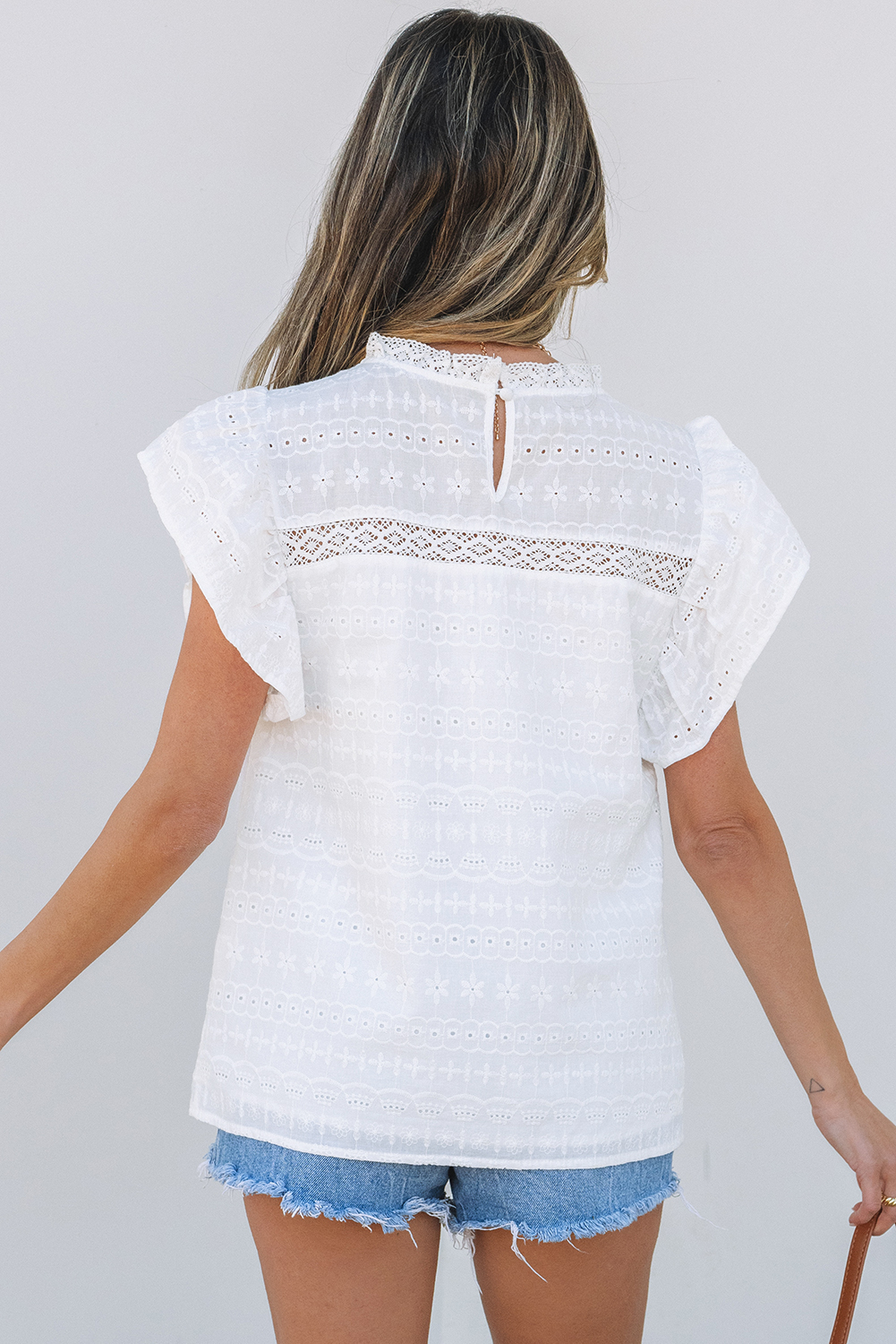 Elegant White Blouse with Flutter Sleeves and Intricate Eyelets - Perfect for Summer - Detail View 2 Elegant White Blouse with Flutter Sleeves and Intricate Eyelets - Perfect for Summer - Detail View 2