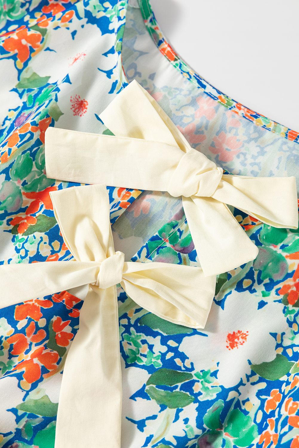 Chic and Romantic V Neck Floral Blouse with Bow Detail - Sleeveless Peplum Style - Detail View 10 Chic and Romantic V Neck Floral Blouse with Bow Detail - Sleeveless Peplum Style - Detail View 10