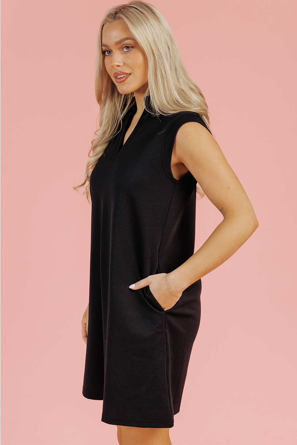 Chic and Elegant Black Mini Dress with Slit Neck and Sleeveless Design - Detail View 10 Chic and Elegant Black Mini Dress with Slit Neck and Sleeveless Design - Detail View 10