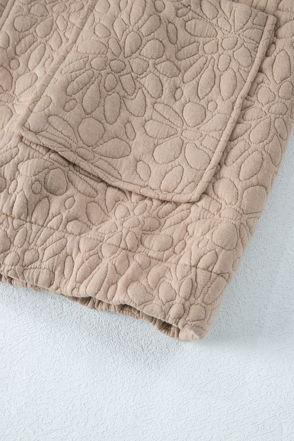 Add a touch of elegance to your wardrobe with this Women's Light French Beige Floral Quilted Jacket. The quilted fabric features a stunning floral design, making it a standout piece for any occasion. The long sleeves and drop shoulders create a comfortable and relaxed fit, while the full-zipped closure ensures a secure and warm wear. This stylish jacket is perfect for daily wear, and its solid color makes it easy to pair with your favorite outfits. The quited design and floral pattern add a touch of whimsy and playfulness, making it a great addition to your winter wardrobe. Whether you're running errands or meeting friends, this jacket is sure to turn heads. - Detail View 19 Add a touch of elegance to your wardrobe with this Women's Light French Beige Floral Quilted Jacket. The quilted fabric features a stunning floral design, making it a standout piece for any occasion. The long sleeves and drop shoulders create a comfortable and relaxed fit, while the full-zipped closure ensures a secure and warm wear. This stylish jacket is perfect for daily wear, and its solid color makes it easy to pair with your favorite outfits. The quited design and floral pattern add a touch of whimsy and playfulness, making it a great addition to your winter wardrobe. Whether you're running errands or meeting friends, this jacket is sure to turn heads. - Detail View 19