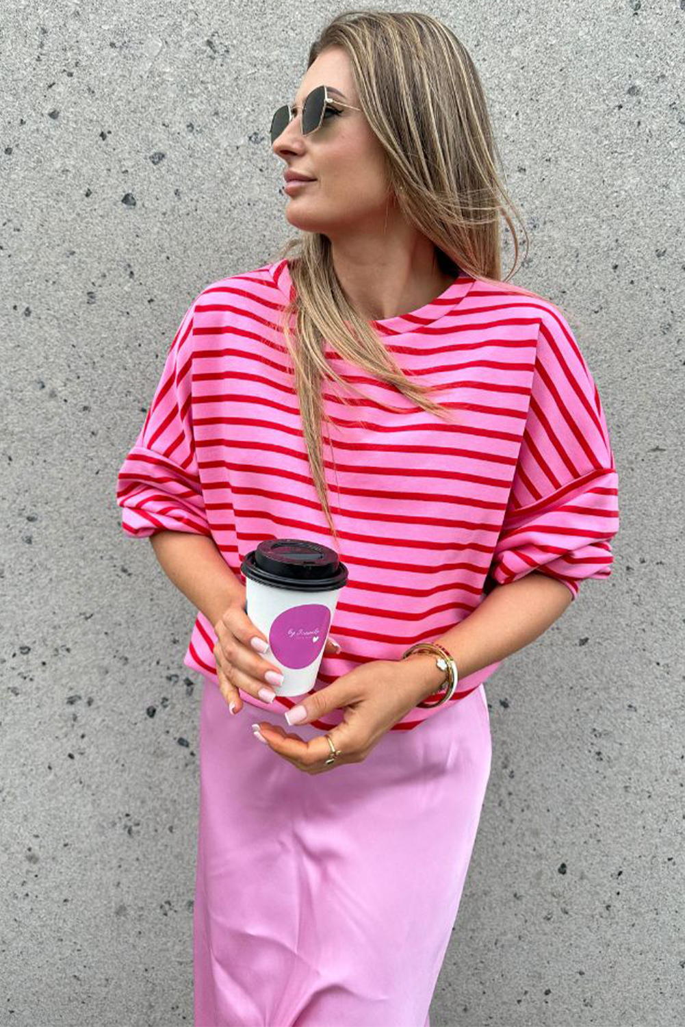 Elevate your casual style with this Women's Sachet Pink Striped Print Crew Neck Drop Shoulder Sweatshirt. The classic crew neck design and relaxed drop shoulder silhouette come together to create a comfortable and modern look. The loose fit ensures an effortless feel, while the 95% cotton and 5% elastane blend provides a soft and stretchy fabric. The striking sachet pink striped print adds a pop of color and visual interest to your outfit. Perfect for daily wear during the fall and autumn seasons, this sweatshirt is a must-have for your casual wardrobe. Pair it with your favorite jeans or leggings for a chic and cozy look. - Detail View 4 Elevate your casual style with this Women's Sachet Pink Striped Print Crew Neck Drop Shoulder Sweatshirt. The classic crew neck design and relaxed drop shoulder silhouette come together to create a comfortable and modern look. The loose fit ensures an effortless feel, while the 95% cotton and 5% elastane blend provides a soft and stretchy fabric. The striking sachet pink striped print adds a pop of color and visual interest to your outfit. Perfect for daily wear during the fall and autumn seasons, this sweatshirt is a must-have for your casual wardrobe. Pair it with your favorite jeans or leggings for a chic and cozy look. - Detail View 4