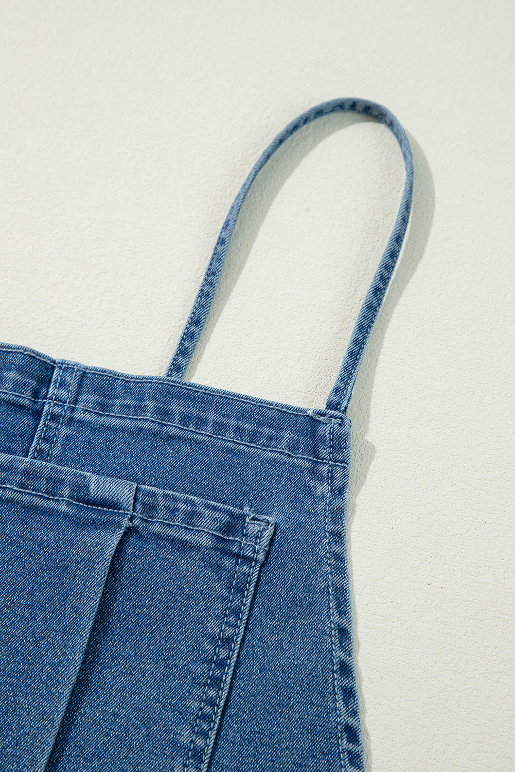 Trendy Dusk Blue Denim Jumpsuit with Adjustable Tie Straps and Bib Pocket - Detail View 10 Trendy Dusk Blue Denim Jumpsuit with Adjustable Tie Straps and Bib Pocket - Detail View 10