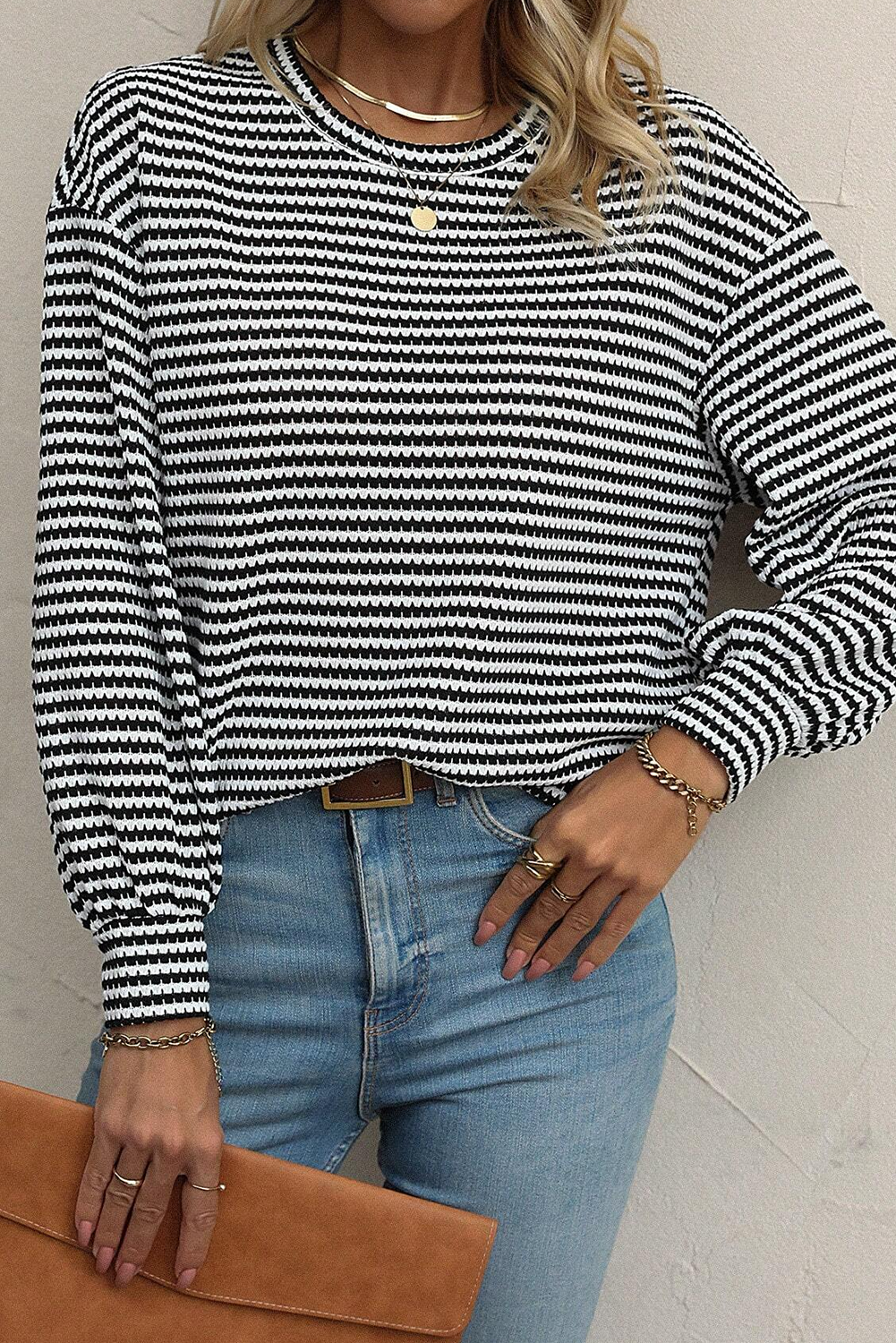 Add a touch of effortless chic to your wardrobe with this Women's Black Stripe Round Neck Drop Shoulder Long Sleeve Top. Featuring a classic black stripe pattern, this top exudes timeless style. The relaxed and trendy drop shoulder design creates a slouchy vibe, perfect for a casual and laid-back look. The comfortable round neck offers easy wear and suits most body types. Made from 97% polyester and 3% elastane, this top ensures a comfortable fit and breathability. It is versatile and stylish, making it ideal for transitional styling. The long sleeves provide coverage and warmth, making it suitable for the fall and autumn seasons. This top is a must-have addition to your wardrobe, offering both comfort and style without any restrictions. - Detail View 4 Add a touch of effortless chic to your wardrobe with this Women's Black Stripe Round Neck Drop Shoulder Long Sleeve Top. Featuring a classic black stripe pattern, this top exudes timeless style. The relaxed and trendy drop shoulder design creates a slouchy vibe, perfect for a casual and laid-back look. The comfortable round neck offers easy wear and suits most body types. Made from 97% polyester and 3% elastane, this top ensures a comfortable fit and breathability. It is versatile and stylish, making it ideal for transitional styling. The long sleeves provide coverage and warmth, making it suitable for the fall and autumn seasons. This top is a must-have addition to your wardrobe, offering both comfort and style without any restrictions. - Detail View 4