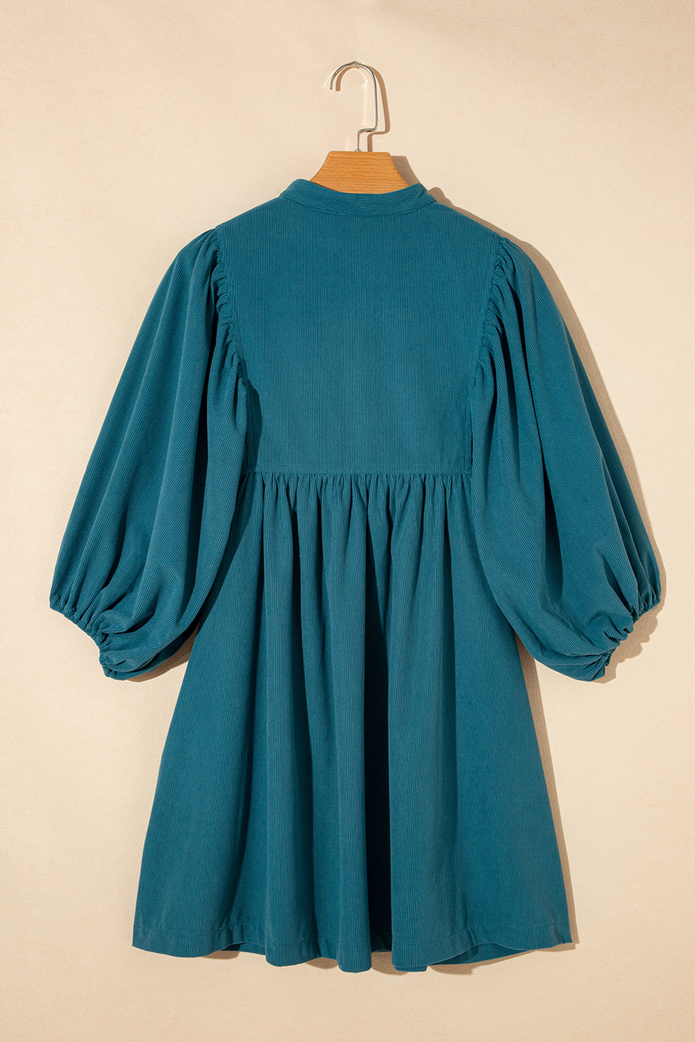 Elevate your style with this Women's Blue Corduroy Snap Buttons Empire Waist Bracelet Sleeve Dress. Crafted from premium 100% polyester, this dress offers a stylish and textured look, perfect for the fall and autumn season. The empire waist creates a flattering silhouette, while the trendy snap buttons add a unique and functional detail to the dress. Featuring chic bracelet sleeves, this dress exudes a modern and fashionable touch. The high waistline adds a touch of elegance and helps create a defined silhouette. The solid blue color and corduroy fabric make it a versatile and on-trend choice for your wardrobe. This short dress is perfect for daily wear and can effortlessly elevate your personal style. - Detail View 9 Elevate your style with this Women's Blue Corduroy Snap Buttons Empire Waist Bracelet Sleeve Dress. Crafted from premium 100% polyester, this dress offers a stylish and textured look, perfect for the fall and autumn season. The empire waist creates a flattering silhouette, while the trendy snap buttons add a unique and functional detail to the dress. Featuring chic bracelet sleeves, this dress exudes a modern and fashionable touch. The high waistline adds a touch of elegance and helps create a defined silhouette. The solid blue color and corduroy fabric make it a versatile and on-trend choice for your wardrobe. This short dress is perfect for daily wear and can effortlessly elevate your personal style. - Detail View 9