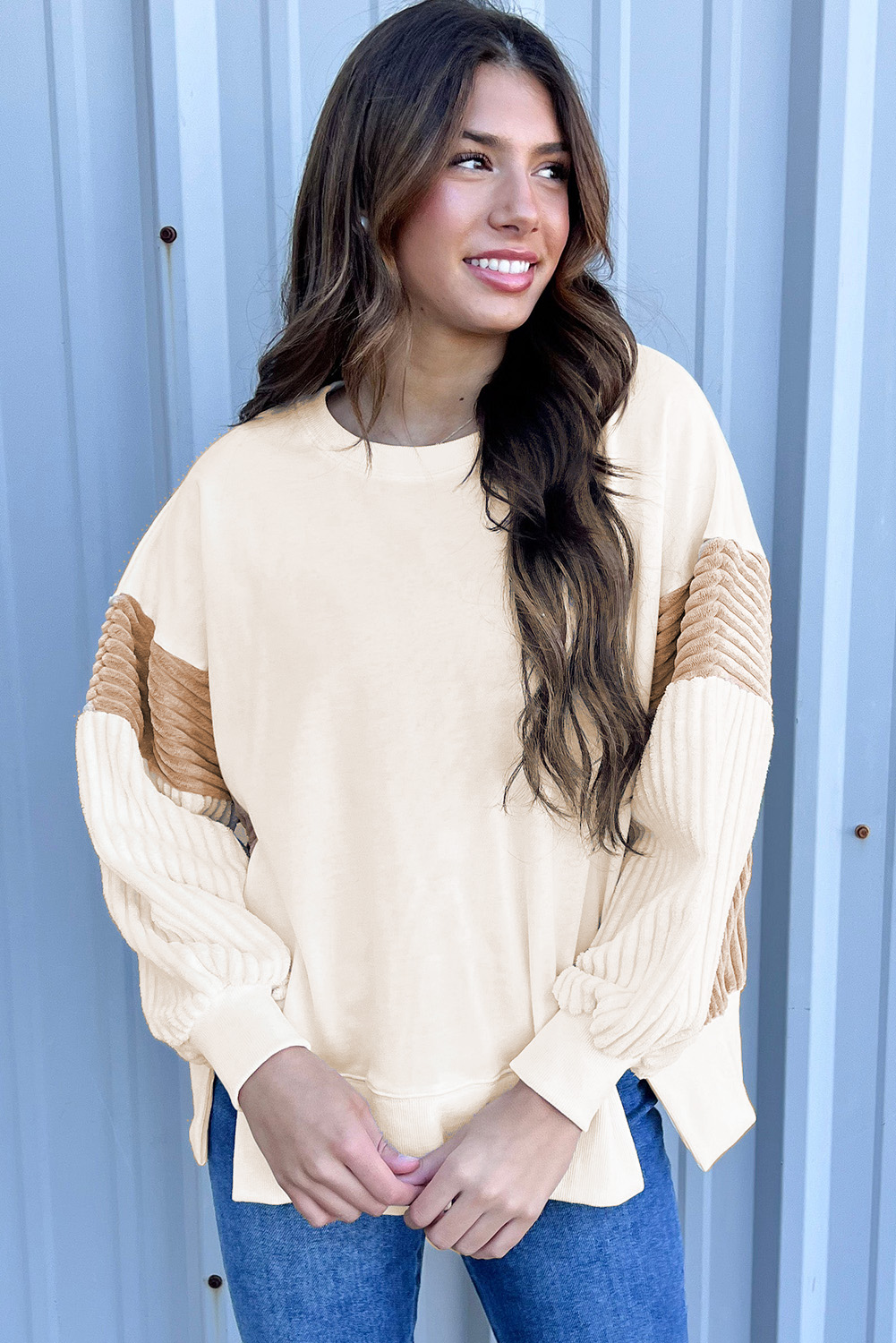 Stay warm and stylish with this Women's Apricot Corduroy Patchwork Drop Shoulder Long Sleeve Sweatshirt. Perfect for daily wear, this casual sweatshirt adds warmth and coverage while keeping you on-trend. The stylish corduroy patchwork sleeves provide a trendy and textured look, adding a unique touch to your outfit. The drop shoulder design ensures a relaxed and comfortable fit, making it ideal for all-day wear. The classic crew neck offers a timeless and versatile style, suitable for various occasions. Made from a blend of 50% polyester and 50% cotton, this sweatshirt guarantees both comfort and durability. The captivating patterns and textures of the sweatshirt make it a standout piece in your wardrobe. Pair it with your favorite jeans or leggings for a casual and chic look. - Detail View 4 Stay warm and stylish with this Women's Apricot Corduroy Patchwork Drop Shoulder Long Sleeve Sweatshirt. Perfect for daily wear, this casual sweatshirt adds warmth and coverage while keeping you on-trend. The stylish corduroy patchwork sleeves provide a trendy and textured look, adding a unique touch to your outfit. The drop shoulder design ensures a relaxed and comfortable fit, making it ideal for all-day wear. The classic crew neck offers a timeless and versatile style, suitable for various occasions. Made from a blend of 50% polyester and 50% cotton, this sweatshirt guarantees both comfort and durability. The captivating patterns and textures of the sweatshirt make it a standout piece in your wardrobe. Pair it with your favorite jeans or leggings for a casual and chic look. - Detail View 4