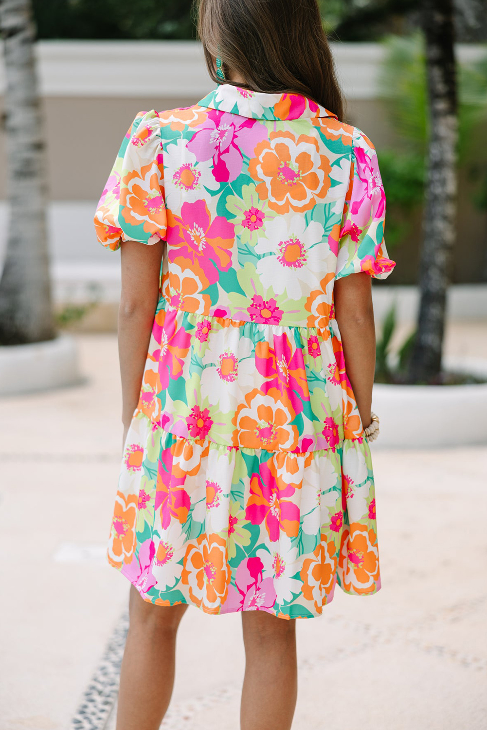Step into spring with grace and charm in this Pink Floral Puff Sleeve Collar Buttoned Babydoll Dress. The delightful floral print adds a touch of femininity and freshness to your look, perfect for embracing the season. Elevate your style effortlessly with the elegant puff sleeves and sophisticated collared and buttoned design of this dress. Made from premium 100% polyester fabric, this dress offers both comfort and style. The A-line silhouette and high waistline create a flattering and chic look, while the short sleeves add a touch of playfulness. Pair this dress with sandals, heels, or boots for a versatile and chic ensemble that's perfect for any daily occasion. Mini dresses are a wardrobe essential, and this pink floral babydoll dress is sure to become a favorite in your collection. - Detail View 4 Step into spring with grace and charm in this Pink Floral Puff Sleeve Collar Buttoned Babydoll Dress. The delightful floral print adds a touch of femininity and freshness to your look, perfect for embracing the season. Elevate your style effortlessly with the elegant puff sleeves and sophisticated collared and buttoned design of this dress. Made from premium 100% polyester fabric, this dress offers both comfort and style. The A-line silhouette and high waistline create a flattering and chic look, while the short sleeves add a touch of playfulness. Pair this dress with sandals, heels, or boots for a versatile and chic ensemble that's perfect for any daily occasion. Mini dresses are a wardrobe essential, and this pink floral babydoll dress is sure to become a favorite in your collection. - Detail View 4