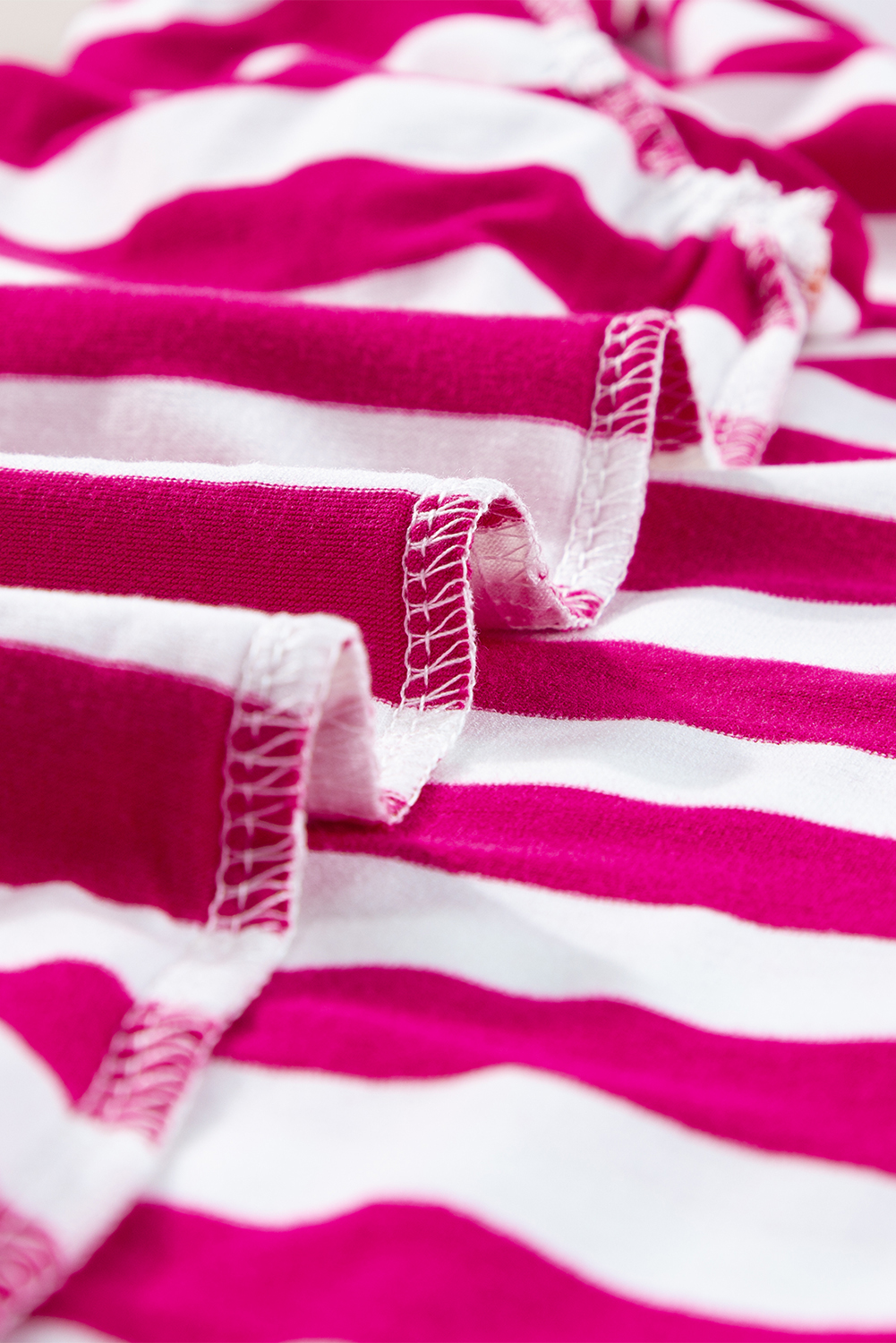 Add a touch of femininity to your everyday look with this Women's Soft Rose Red Striped Ruffle Sleeve Crew Neck Blouse. Featuring a timeless striped pattern, this blouse provides a chic and versatile look. The ruffle sleeves add a playful and charming touch, while the comfortable crew neck design ensures a relaxed fit. The slim fit of the blouse creates a flattering silhouette, making it suitable for a variety of occasions. Made from a soft blend of 50% viscose, 45% polyester, and 5% elastane, this blouse is both durable and gentle on the skin. Whether you're heading to work or simply want to elevate your casual look, this blouse is a must-have addition to your wardrobe. Its delicate cuttings and attractive prices make it an affordable and stylish choice. - Detail View 9 Add a touch of femininity to your everyday look with this Women's Soft Rose Red Striped Ruffle Sleeve Crew Neck Blouse. Featuring a timeless striped pattern, this blouse provides a chic and versatile look. The ruffle sleeves add a playful and charming touch, while the comfortable crew neck design ensures a relaxed fit. The slim fit of the blouse creates a flattering silhouette, making it suitable for a variety of occasions. Made from a soft blend of 50% viscose, 45% polyester, and 5% elastane, this blouse is both durable and gentle on the skin. Whether you're heading to work or simply want to elevate your casual look, this blouse is a must-have addition to your wardrobe. Its delicate cuttings and attractive prices make it an affordable and stylish choice. - Detail View 9