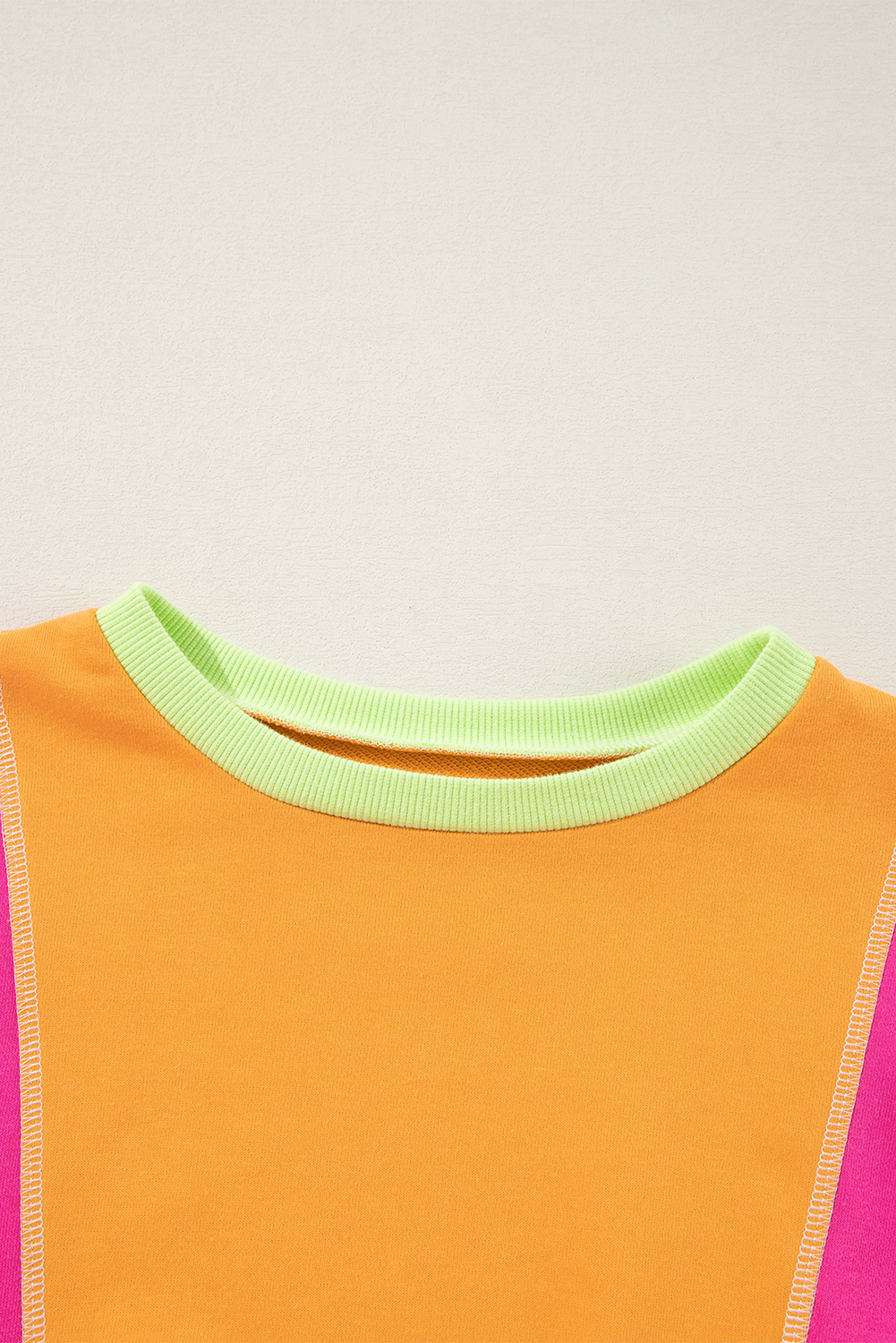 Women's Grapefruit Orange Colorblock Oversize Top with Exposed Stitching - Detail View 6 Women's Grapefruit Orange Colorblock Oversize Top with Exposed Stitching - Detail View 6