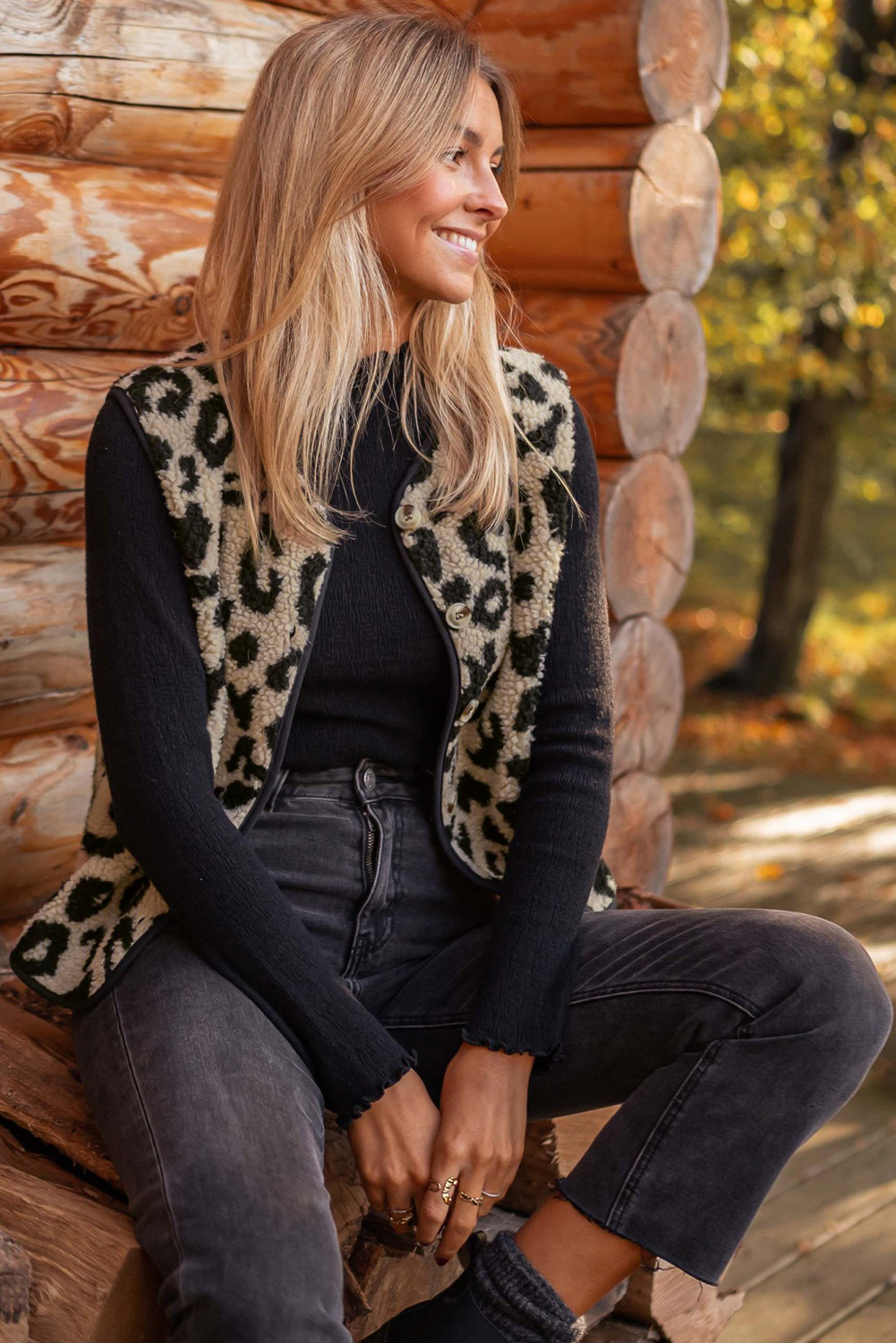 Elevate your outfit and embrace your wild side with this Women's Black Leopard Print Sherpa Vest Coat. The striking leopard print adds a bold and fashionable touch to your look, while the plush sherpa material ensures optimal warmth and comfort during the winter season. The versatile open front design allows for easy layering and adds a stylish element to any outfit. This sleeveless vest coat is perfect for adding a statement to your daily ensembles, offering both style and functionality. Made from premium 100% polyester, this vest coat is durable and easy to maintain. Embrace the casual and Western-inspired style with this chic and cozy addition to your winter wardrobe. - Detail View 14 Elevate your outfit and embrace your wild side with this Women's Black Leopard Print Sherpa Vest Coat. The striking leopard print adds a bold and fashionable touch to your look, while the plush sherpa material ensures optimal warmth and comfort during the winter season. The versatile open front design allows for easy layering and adds a stylish element to any outfit. This sleeveless vest coat is perfect for adding a statement to your daily ensembles, offering both style and functionality. Made from premium 100% polyester, this vest coat is durable and easy to maintain. Embrace the casual and Western-inspired style with this chic and cozy addition to your winter wardrobe. - Detail View 14