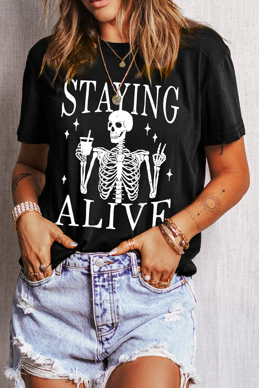 Quirky Halloween Tee: STAYING ALIVE Slogan with Skeleton Print - Detail View 2 Quirky Halloween Tee: STAYING ALIVE Slogan with Skeleton Print - Detail View 2