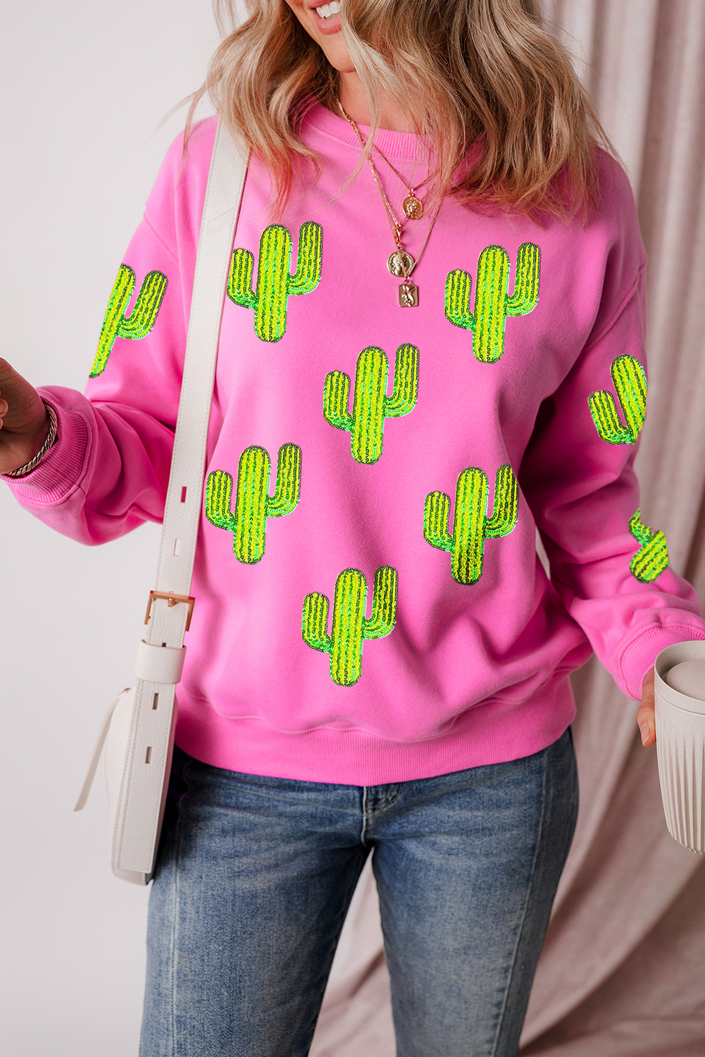 Elevate your casual style with this Women's Bonbon Sequined Cactus Pattern Crewneck Pullover Sweatshirt. The luxurious sequins and eye-catching cactus pattern make this sweatshirt a standout piece, perfect for adding a touch of Western flair to your outfit. The relaxed fit ensures a comfortable and cozy wear, suitable for everyday comfort and style. Pair it with jeans or casual pants for an eye-catching look, or layer it over a dress for a unique addition to your wardrobe. This graphic sweatshirt is ideal for cool weather, and is sure to become a favorite in your wardrobe. - Detail View 4 Elevate your casual style with this Women's Bonbon Sequined Cactus Pattern Crewneck Pullover Sweatshirt. The luxurious sequins and eye-catching cactus pattern make this sweatshirt a standout piece, perfect for adding a touch of Western flair to your outfit. The relaxed fit ensures a comfortable and cozy wear, suitable for everyday comfort and style. Pair it with jeans or casual pants for an eye-catching look, or layer it over a dress for a unique addition to your wardrobe. This graphic sweatshirt is ideal for cool weather, and is sure to become a favorite in your wardrobe. - Detail View 4