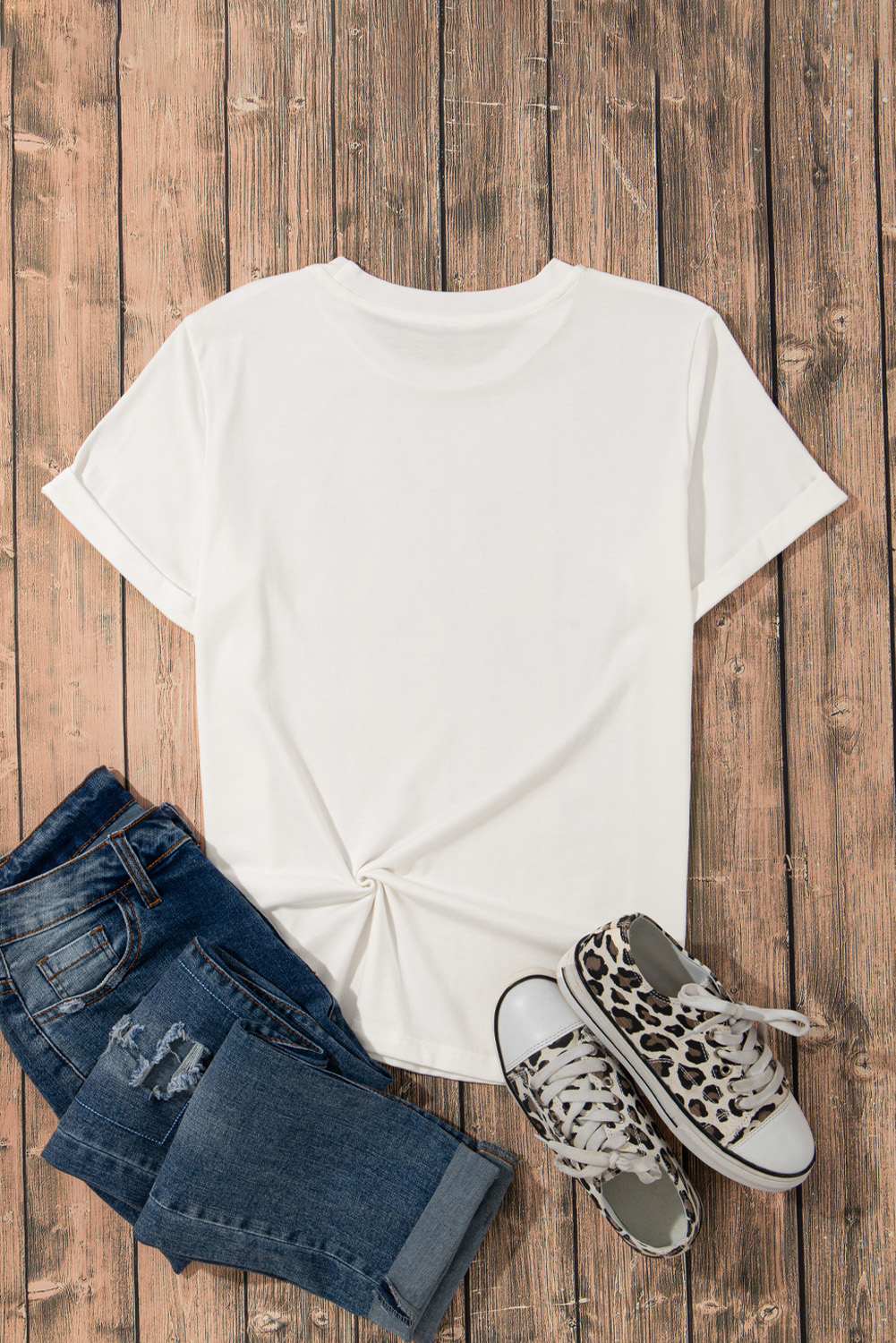 Elevate your style with this Women's White Large Rose Print Round Neck Short Sleeve Graphic T-Shirt. The delicate rose pattern adds a touch of femininity and romance to your outfit, while the breathable and soft fabric ensures all-day comfort. Pair it with jeans or denim shorts for a chic and casual look that's perfect for any occasion. This graphic tee is designed to keep you cool and stylish, featuring a round neck and short sleeves. The large rose print is a beautiful and eye-catching touch that adds visual interest to your outfit. This versatile tee is a must-have addition to your wardrobe, featuring a relaxed fit and easy care design. - Detail View 9 Elevate your style with this Women's White Large Rose Print Round Neck Short Sleeve Graphic T-Shirt. The delicate rose pattern adds a touch of femininity and romance to your outfit, while the breathable and soft fabric ensures all-day comfort. Pair it with jeans or denim shorts for a chic and casual look that's perfect for any occasion. This graphic tee is designed to keep you cool and stylish, featuring a round neck and short sleeves. The large rose print is a beautiful and eye-catching touch that adds visual interest to your outfit. This versatile tee is a must-have addition to your wardrobe, featuring a relaxed fit and easy care design. - Detail View 9