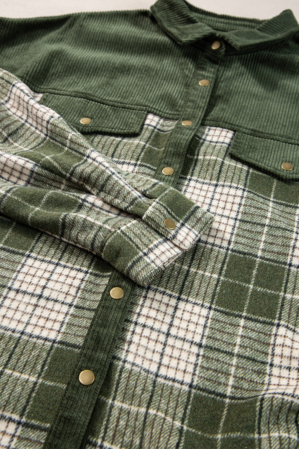 Add a touch of modern and eye-catching style to your wardrobe with this Women's Blackish Green Snap Buttons Colorblock Plaid Shacket. The jacket is combined with trendy corduroy patchwork, featuring a unique colorblock design for a contemporary and fashionable look. The convenient snap buttons provide easy closure and give the shacket a casual vibe. The classic shirt collar adds a touch of sophistication to the style, making it versatile for various occasions. Made from premium 100% polyester, this shacket ensures durability and comfort. The captivating plaid patterns and textures make it a standout piece in your outerwear collection. Perfect for the fall and autumn season, this shacket is a must-have for fashion-forward women who appreciate unique and stylish clothing choices. - Detail View 14 Add a touch of modern and eye-catching style to your wardrobe with this Women's Blackish Green Snap Buttons Colorblock Plaid Shacket. The jacket is combined with trendy corduroy patchwork, featuring a unique colorblock design for a contemporary and fashionable look. The convenient snap buttons provide easy closure and give the shacket a casual vibe. The classic shirt collar adds a touch of sophistication to the style, making it versatile for various occasions. Made from premium 100% polyester, this shacket ensures durability and comfort. The captivating plaid patterns and textures make it a standout piece in your outerwear collection. Perfect for the fall and autumn season, this shacket is a must-have for fashion-forward women who appreciate unique and stylish clothing choices. - Detail View 14