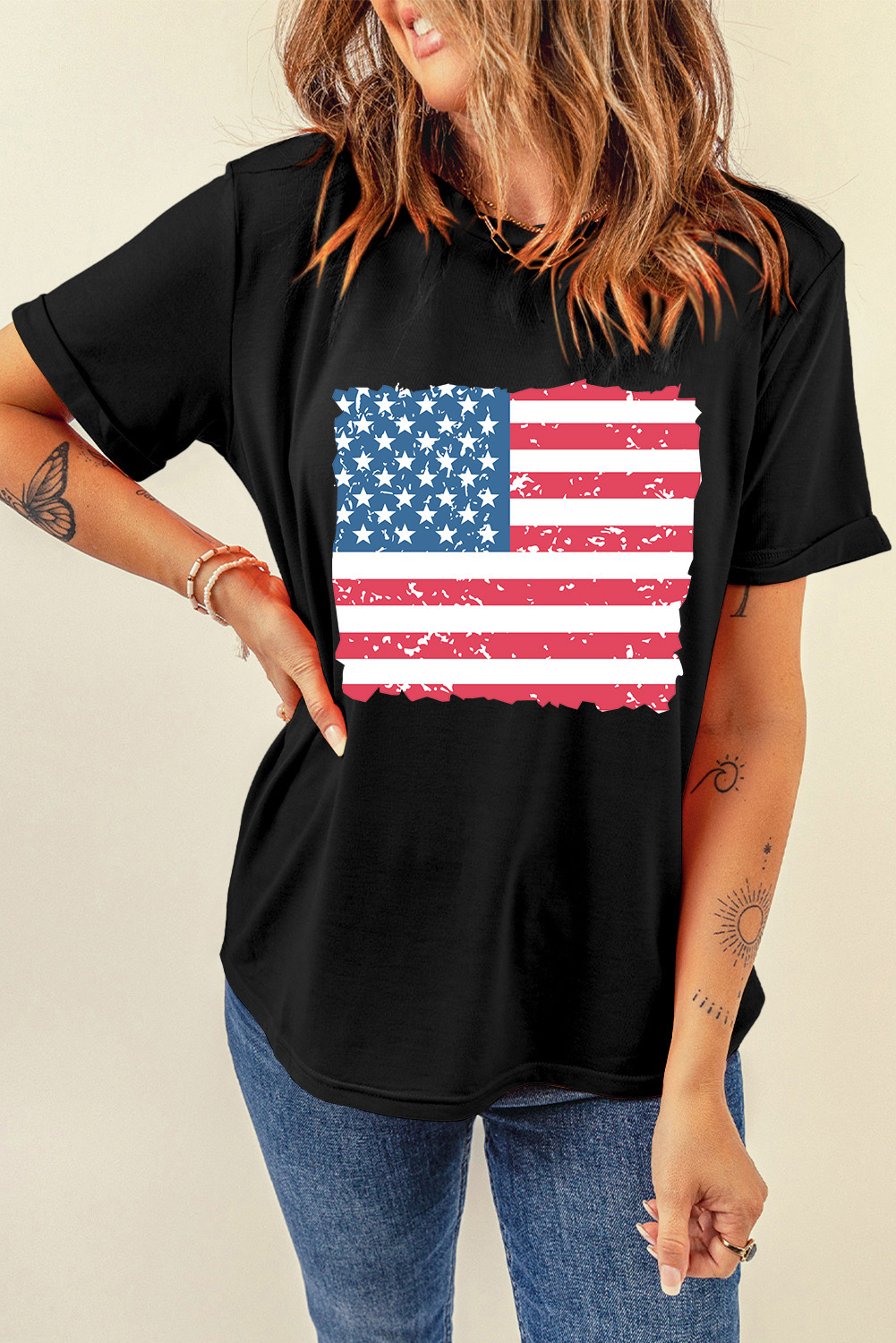 Make a statement with this bold and patriotic Women's Black American Flag Printed Crewneck T-Shirt. The classic crew neck design gets a casual and vintage touch with the frayed edges, while the graphic print of the American flag adds a pop of color and a conversation starter. The soft and durable fabric ensures everyday comfort and wear, making it perfect for pairing with your favorite denim bottoms for a laid-back vibe. This shirt is a great way to show off your patriotic pride and add a touch of personality to your outfit. - Detail View 4 Make a statement with this bold and patriotic Women's Black American Flag Printed Crewneck T-Shirt. The classic crew neck design gets a casual and vintage touch with the frayed edges, while the graphic print of the American flag adds a pop of color and a conversation starter. The soft and durable fabric ensures everyday comfort and wear, making it perfect for pairing with your favorite denim bottoms for a laid-back vibe. This shirt is a great way to show off your patriotic pride and add a touch of personality to your outfit. - Detail View 4
