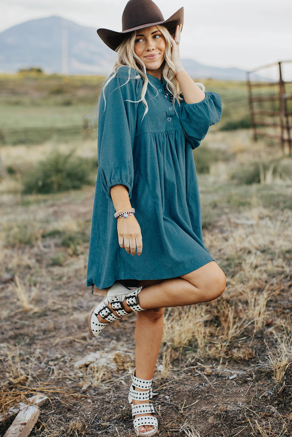 Elevate your style with this Women's Blue Corduroy Snap Buttons Empire Waist Bracelet Sleeve Dress. Crafted from premium 100% polyester, this dress offers a stylish and textured look, perfect for the fall and autumn season. The empire waist creates a flattering silhouette, while the trendy snap buttons add a unique and functional detail to the dress. Featuring chic bracelet sleeves, this dress exudes a modern and fashionable touch. The high waistline adds a touch of elegance and helps create a defined silhouette. The solid blue color and corduroy fabric make it a versatile and on-trend choice for your wardrobe. This short dress is perfect for daily wear and can effortlessly elevate your personal style. - Detail View 4 Elevate your style with this Women's Blue Corduroy Snap Buttons Empire Waist Bracelet Sleeve Dress. Crafted from premium 100% polyester, this dress offers a stylish and textured look, perfect for the fall and autumn season. The empire waist creates a flattering silhouette, while the trendy snap buttons add a unique and functional detail to the dress. Featuring chic bracelet sleeves, this dress exudes a modern and fashionable touch. The high waistline adds a touch of elegance and helps create a defined silhouette. The solid blue color and corduroy fabric make it a versatile and on-trend choice for your wardrobe. This short dress is perfect for daily wear and can effortlessly elevate your personal style. - Detail View 4