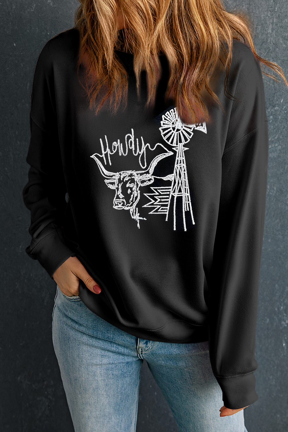Ride into comfort and style with this Women's Black Embroidered Howdy Cow Western Graphic Crew Neck Sweatshirt. The classic crew neck and drop shoulder design provide a timeless fit, while the black color is both versatile and easy to pair. The embroidered Howdy and cow pattern add a playful and whimsical touch, inspired by the Wild West. Perfect for lounging or outdoor activities, this graphic sweatshirt is a unique and stylish addition to your wardrobe. Pair it with denim or casual wear for a complete Western-inspired outfit. - Detail View 4 Ride into comfort and style with this Women's Black Embroidered Howdy Cow Western Graphic Crew Neck Sweatshirt. The classic crew neck and drop shoulder design provide a timeless fit, while the black color is both versatile and easy to pair. The embroidered Howdy and cow pattern add a playful and whimsical touch, inspired by the Wild West. Perfect for lounging or outdoor activities, this graphic sweatshirt is a unique and stylish addition to your wardrobe. Pair it with denim or casual wear for a complete Western-inspired outfit. - Detail View 4