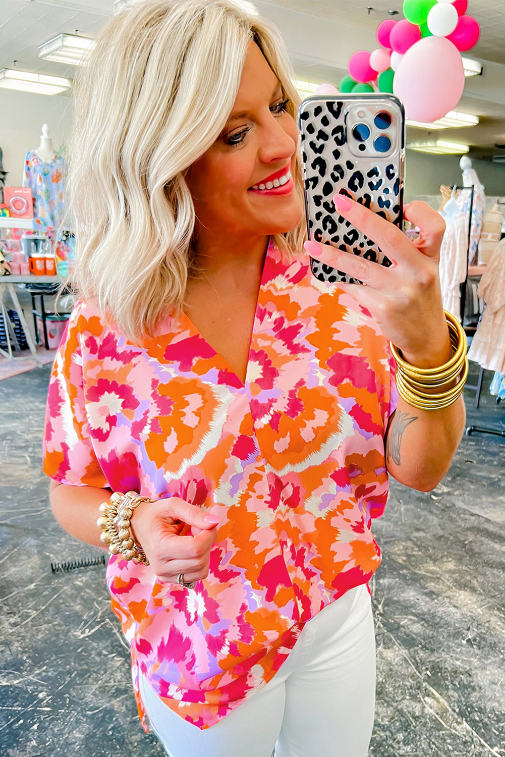 Elevate your summer style with this Women's Stylish Rose Red Abstract Print V-Neck Summer Blouse. Crafted from smooth and lightweight 100% polyester fabric, this blouse offers great comfort and is perfect for daily wear during the warm season. The eye-catching abstract pattern is unique and head-turning, adding a touch of personality to your outfit. The face-shaping V-neck and cool short sleeves make this blouse a graceful and popular choice for any occasion. Pair it with your favorite jeans or shorts for a stylish and effortless look that is sure to make a statement. Add this best-selling blouse to your wardrobe for a versatile and fashionable option. - Detail View 4 Elevate your summer style with this Women's Stylish Rose Red Abstract Print V-Neck Summer Blouse. Crafted from smooth and lightweight 100% polyester fabric, this blouse offers great comfort and is perfect for daily wear during the warm season. The eye-catching abstract pattern is unique and head-turning, adding a touch of personality to your outfit. The face-shaping V-neck and cool short sleeves make this blouse a graceful and popular choice for any occasion. Pair it with your favorite jeans or shorts for a stylish and effortless look that is sure to make a statement. Add this best-selling blouse to your wardrobe for a versatile and fashionable option. - Detail View 4