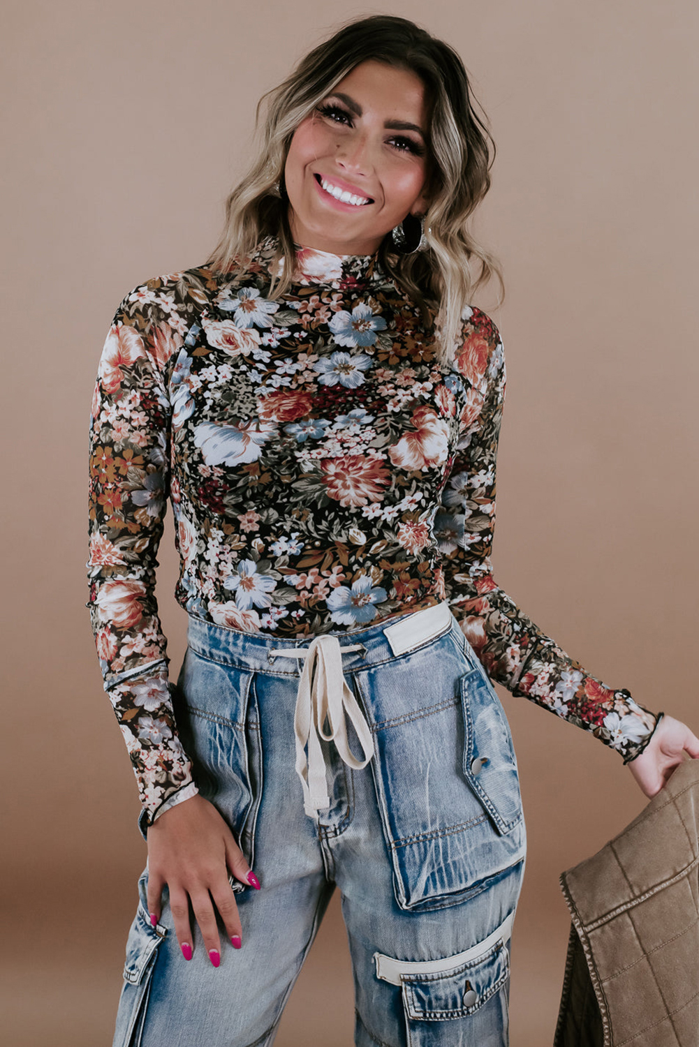 Elevate your style with this Women's Brown Floral High Neck Long Sleeve Sheath Blouse. The high neck design offers a polished and professional look, while the sheath cut accentuates the silhouette with feminine grace. The mesh fabric adds a subtle allure and a touch of modernity to the blouse. Pair it with tailored pants or skirts for a pretty ensemble. This blouse is perfect for daily wear, whether for a casual or formal occasion. The 95% polyester and 5% elastane blend ensures durability and comfort. The floral print in brown adds a touch of elegance and sophistication to your outfit. - Detail View 4 Elevate your style with this Women's Brown Floral High Neck Long Sleeve Sheath Blouse. The high neck design offers a polished and professional look, while the sheath cut accentuates the silhouette with feminine grace. The mesh fabric adds a subtle allure and a touch of modernity to the blouse. Pair it with tailored pants or skirts for a pretty ensemble. This blouse is perfect for daily wear, whether for a casual or formal occasion. The 95% polyester and 5% elastane blend ensures durability and comfort. The floral print in brown adds a touch of elegance and sophistication to your outfit. - Detail View 4