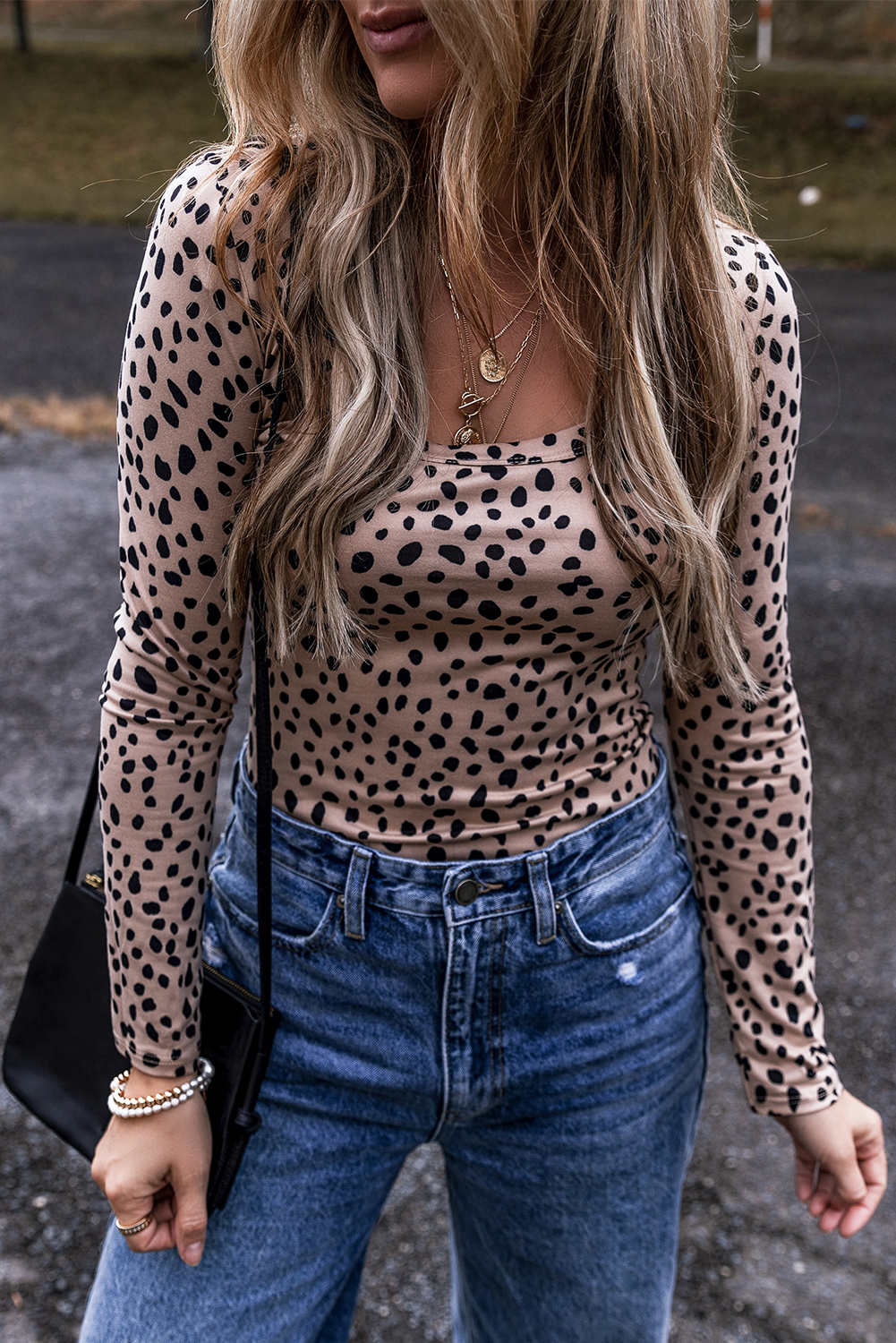 Make a confident statement with this bold and striking Smoke Grey Leopard Print Long Sleeve Scoop Neck Slim Fit Bodysuit. The long sleeves add warmth and versatility, while the scoop neck cut flatters your neckline. The slim fit silhouette creates a sleek and feminine look, perfect for daily wear. The leopard print adds a touch of elegance and sophistication, making it ideal for both casual and dressy occasions. Pair it with high-waisted pants or a flowy skirt for a chic and stylish ensemble. This bodysuit is designed to be both comfortable and stylish, offering the perfect balance between chic and casual. - Detail View 4 Make a confident statement with this bold and striking Smoke Grey Leopard Print Long Sleeve Scoop Neck Slim Fit Bodysuit. The long sleeves add warmth and versatility, while the scoop neck cut flatters your neckline. The slim fit silhouette creates a sleek and feminine look, perfect for daily wear. The leopard print adds a touch of elegance and sophistication, making it ideal for both casual and dressy occasions. Pair it with high-waisted pants or a flowy skirt for a chic and stylish ensemble. This bodysuit is designed to be both comfortable and stylish, offering the perfect balance between chic and casual. - Detail View 4