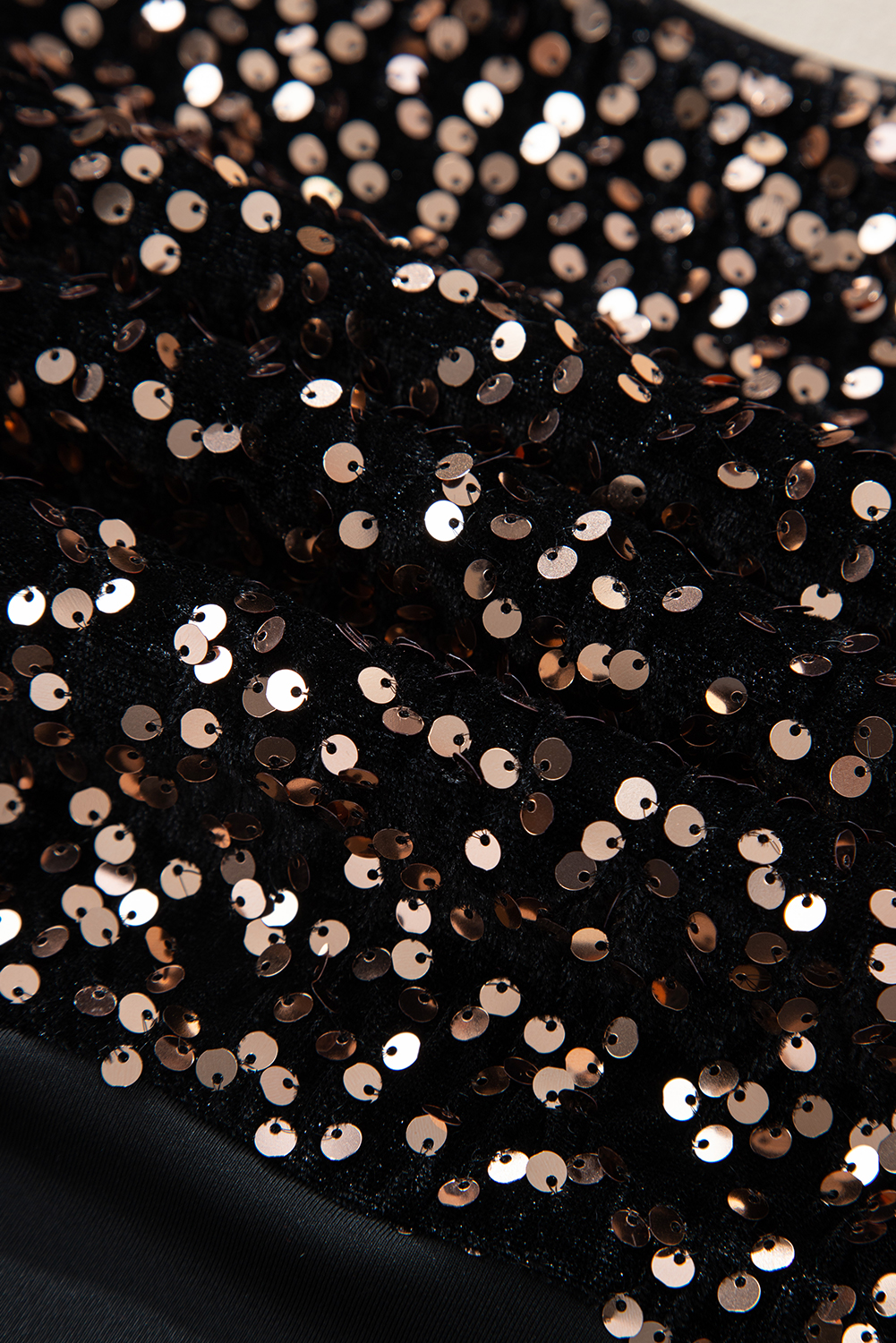 Elevate your style with this stunning Women's Black Sequin Bodysuit. The intricate sequined design adds a touch of glamour, while the deep V back and puff sleeves create a dramatic and elegant look. The round neck balances the bold back and sleeves, perfect for a night out or date. Made from 100% PET, this bodysuit is both comfortable and durable. Whether you're dressing up or dressing down, this bodysuit is the perfect combination of chic and casual. Pair it with your favorite tight jeans, knee-length skirt, or trousers for a stylish and comfortable outfit. - Detail View 9 Elevate your style with this stunning Women's Black Sequin Bodysuit. The intricate sequined design adds a touch of glamour, while the deep V back and puff sleeves create a dramatic and elegant look. The round neck balances the bold back and sleeves, perfect for a night out or date. Made from 100% PET, this bodysuit is both comfortable and durable. Whether you're dressing up or dressing down, this bodysuit is the perfect combination of chic and casual. Pair it with your favorite tight jeans, knee-length skirt, or trousers for a stylish and comfortable outfit. - Detail View 9