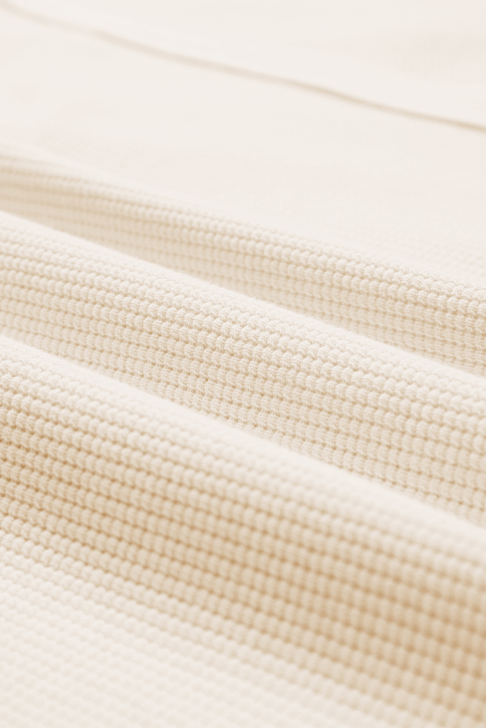 Cozy and Stylish: White Waffle Knit Split Sweatshirt with Bishop Sleeves - Detail View 12 Cozy and Stylish: White Waffle Knit Split Sweatshirt with Bishop Sleeves - Detail View 12