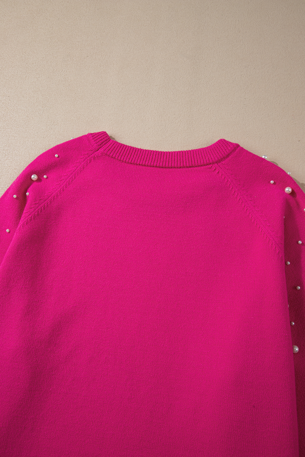 Stay warm and stylish with this Women's Strawberry Pink Pearled Decor Raglan Sleeve Plus Size Sweater. Made with luxurious soft fabric, this sweater provides a cozy and warm feel on chilly days. The unique pearled detailing adds a touch of elegance to your everyday look, while the raglan sleeves give it a trendy casual style. Designed to fit plus-size women, this sweater offers a comfortable and flattering fit. Pair it with your favorite jeans and boots for a chic and effortless winter look. This sweater is a must-have for your winter wardrobe, offering both comfort and style. - Detail View 9 Stay warm and stylish with this Women's Strawberry Pink Pearled Decor Raglan Sleeve Plus Size Sweater. Made with luxurious soft fabric, this sweater provides a cozy and warm feel on chilly days. The unique pearled detailing adds a touch of elegance to your everyday look, while the raglan sleeves give it a trendy casual style. Designed to fit plus-size women, this sweater offers a comfortable and flattering fit. Pair it with your favorite jeans and boots for a chic and effortless winter look. This sweater is a must-have for your winter wardrobe, offering both comfort and style. - Detail View 9