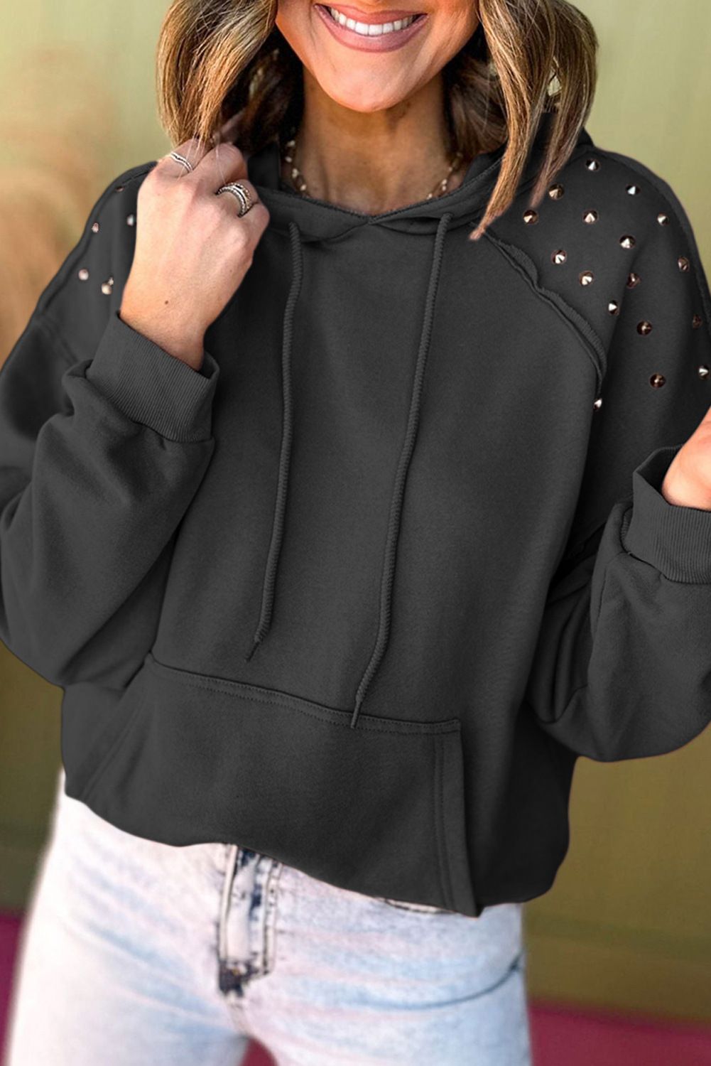 Casual and Edgy Black Hoodie with Rivet Studded Sleeves and Kangaroo Pocket - Detail View 2 Casual and Edgy Black Hoodie with Rivet Studded Sleeves and Kangaroo Pocket - Detail View 2