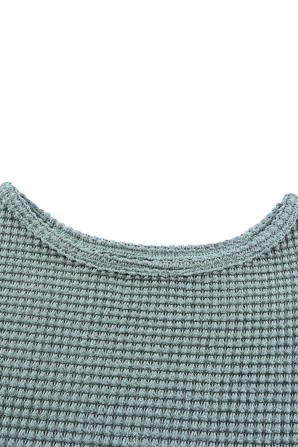Elevate your casual wardrobe with this Women's Green Waffle Knit Drop Shoulder Long Sleeve Top. Crafted from a fine blend of 95% polyester and 5% elastane, this top offers exceptional comfort and a touch of luxury. The waffle knit texture adds a high-class and fashionable element to the top, making it a versatile and trendy choice for your winter outfits. The drop shoulder design enhances the slouchy and relaxed feel of the top, ensuring both style and comfort. Pair it effortlessly with any bottoms, including jeans, skirts, or joggers, for a chic and laid-back look. This long sleeve top is perfect for all seasons except for summer, offering warmth and style during the cooler months. Add this stylish and comfortable top to your daily rotation for a fashionable and cozy ensemble. - Detail View 9 Elevate your casual wardrobe with this Women's Green Waffle Knit Drop Shoulder Long Sleeve Top. Crafted from a fine blend of 95% polyester and 5% elastane, this top offers exceptional comfort and a touch of luxury. The waffle knit texture adds a high-class and fashionable element to the top, making it a versatile and trendy choice for your winter outfits. The drop shoulder design enhances the slouchy and relaxed feel of the top, ensuring both style and comfort. Pair it effortlessly with any bottoms, including jeans, skirts, or joggers, for a chic and laid-back look. This long sleeve top is perfect for all seasons except for summer, offering warmth and style during the cooler months. Add this stylish and comfortable top to your daily rotation for a fashionable and cozy ensemble. - Detail View 9