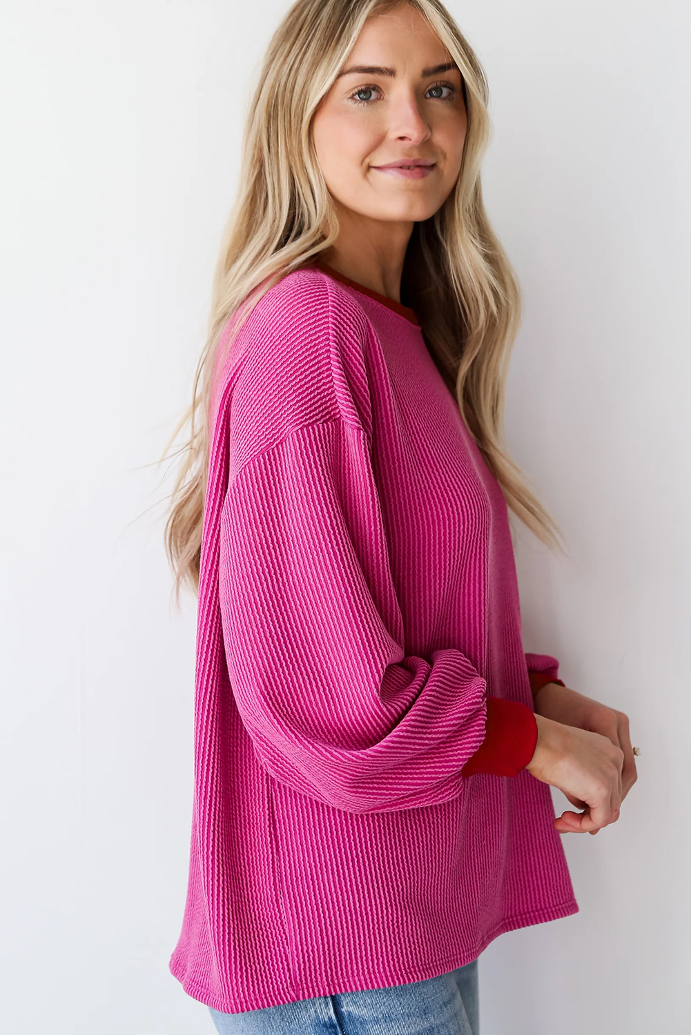 Elevate your wardrobe with this Women's Bright Pink Corded Contrast Edge Drop Shoulder Long Sleeve Top. The contrasting edge detail adds a modern touch, while the corded design gives the top a trendy and stylish look. The comfortable drop shoulder design ensures a relaxed fit, making it perfect for daily wear. The versatile long sleeve top is suitable for various occasions, from casual to dressy, and is a must-have in every woman's wardrobe. Made from a blend of 75% polyester, 20% viscose, and 5% elastane, this top offers both comfort and durability. Pair it with your favorite jeans or leggings for a chic and effortless look. - Detail View 4 Elevate your wardrobe with this Women's Bright Pink Corded Contrast Edge Drop Shoulder Long Sleeve Top. The contrasting edge detail adds a modern touch, while the corded design gives the top a trendy and stylish look. The comfortable drop shoulder design ensures a relaxed fit, making it perfect for daily wear. The versatile long sleeve top is suitable for various occasions, from casual to dressy, and is a must-have in every woman's wardrobe. Made from a blend of 75% polyester, 20% viscose, and 5% elastane, this top offers both comfort and durability. Pair it with your favorite jeans or leggings for a chic and effortless look. - Detail View 4