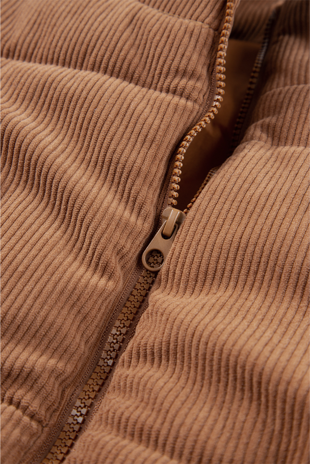 Stay warm and stylish with this Women's Coffee Corduroy Stand Neck Zip Puffer Vest. The stand neck design adds a touch of elegance and sophistication, while the puffer style provides added insulation and a fashion-forward statement. The zipper closure makes it easy to wear and offers a sleek look. This vest is made from 100% polyester and features a solid coffee color, making it perfect for daily wear in the winter season. Pair it with your favorite dress or top and jeans for a chic and cozy outfit. With this vest, you can effortlessly elevate your personal style and stay warm and comfortable all day long. - Detail View 9 Stay warm and stylish with this Women's Coffee Corduroy Stand Neck Zip Puffer Vest. The stand neck design adds a touch of elegance and sophistication, while the puffer style provides added insulation and a fashion-forward statement. The zipper closure makes it easy to wear and offers a sleek look. This vest is made from 100% polyester and features a solid coffee color, making it perfect for daily wear in the winter season. Pair it with your favorite dress or top and jeans for a chic and cozy outfit. With this vest, you can effortlessly elevate your personal style and stay warm and comfortable all day long. - Detail View 9