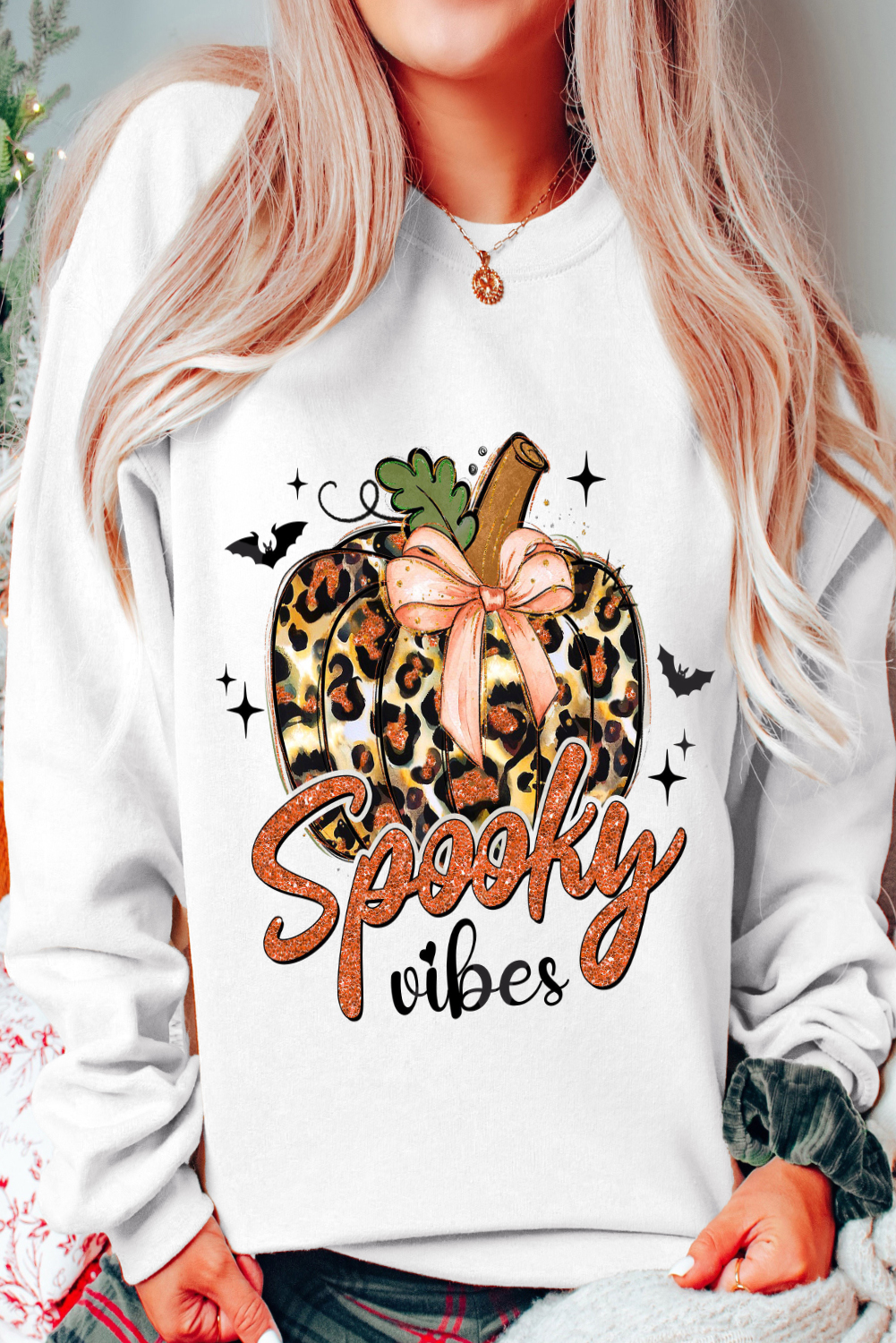 Get into the Halloween spirit with this Women's Beige Spooky Leopard Pumpkin Print Crew Neck Sweatshirt. Stand out with the unique and spooky leopard pumpkin graphic print, perfect for adding a touch of Halloween fun to your outfit. The classic crew neck style offers a comfortable and casual look, while the long sleeves keep you cozy and stylish for the season. Made from a premium blend of 50% polyester and 50% cotton, this sweatshirt ensures durability and comfort for all-day wear. The versatile style of graphic sweatshirts makes it a must-have for updating your wardrobe and adding a playful twist to your daily outfits. - Detail View 9 Get into the Halloween spirit with this Women's Beige Spooky Leopard Pumpkin Print Crew Neck Sweatshirt. Stand out with the unique and spooky leopard pumpkin graphic print, perfect for adding a touch of Halloween fun to your outfit. The classic crew neck style offers a comfortable and casual look, while the long sleeves keep you cozy and stylish for the season. Made from a premium blend of 50% polyester and 50% cotton, this sweatshirt ensures durability and comfort for all-day wear. The versatile style of graphic sweatshirts makes it a must-have for updating your wardrobe and adding a playful twist to your daily outfits. - Detail View 9