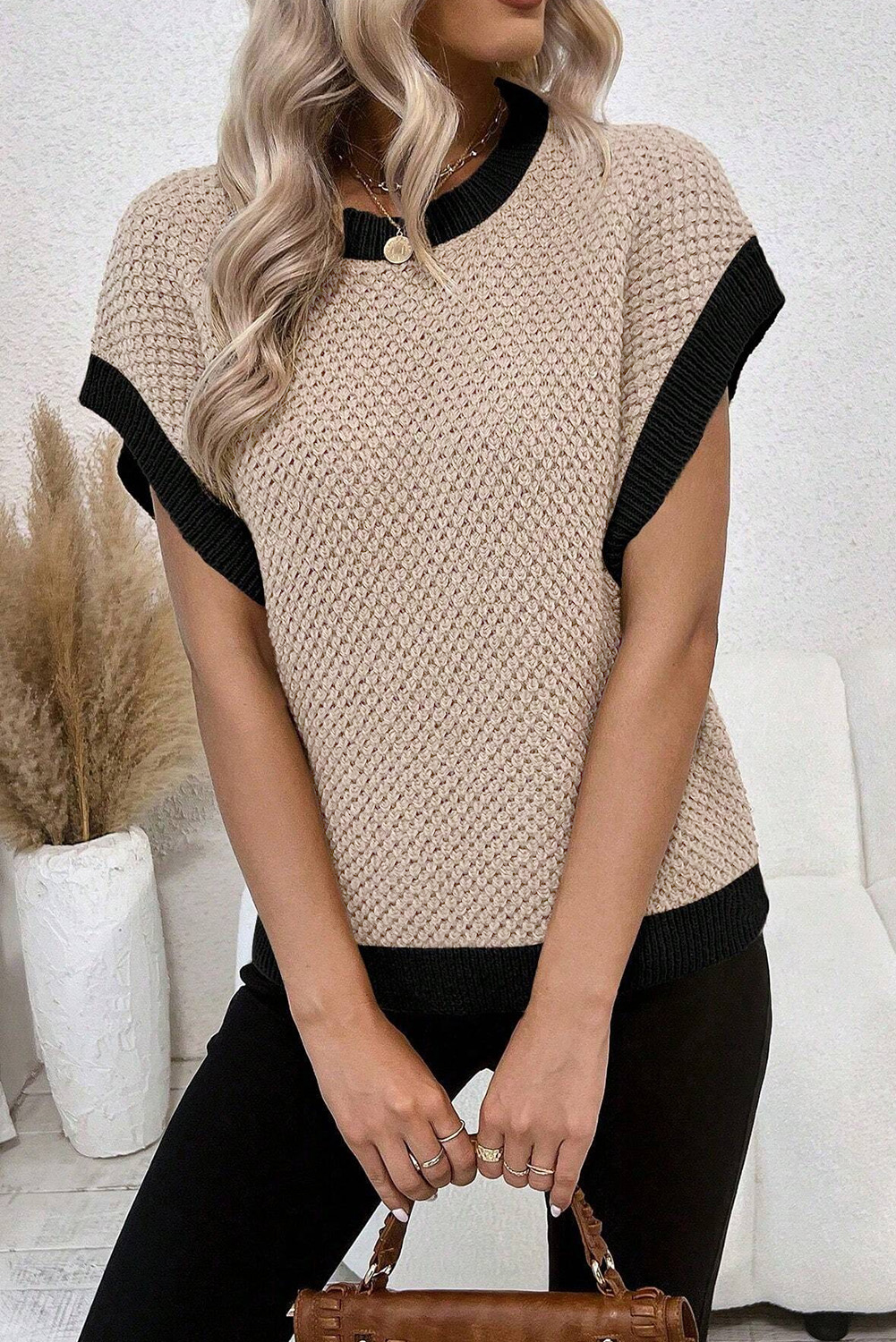 Discover the perfect balance of comfort and style with this Light French Beige Contrast Trim Round Neck Batwing Sleeve Sweater Top. The short sleeve design and contrast trim create a chic color-block effect, making it an effortless way to elevate your everyday outfit. The batwing sleeves add a romantic touch to the sweater, while the round neckline adds a touch of sophistication. Crafted from a blend of 55% acrylic and 45% cotton, this lightweight sweater is perfect for spring and summer wear. Enjoy a comfortable fit and a fashionable look with this best-selling sweater top. - Detail View 4 Discover the perfect balance of comfort and style with this Light French Beige Contrast Trim Round Neck Batwing Sleeve Sweater Top. The short sleeve design and contrast trim create a chic color-block effect, making it an effortless way to elevate your everyday outfit. The batwing sleeves add a romantic touch to the sweater, while the round neckline adds a touch of sophistication. Crafted from a blend of 55% acrylic and 45% cotton, this lightweight sweater is perfect for spring and summer wear. Enjoy a comfortable fit and a fashionable look with this best-selling sweater top. - Detail View 4