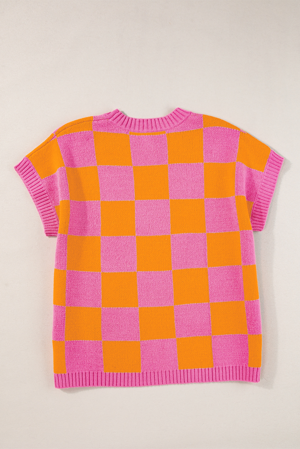 Add a touch of sophistication and modern twist to your summer wardrobe with this Strawberry Pink Colorblock Plaid Pattern Ribbed Trim Sweater Tank Top. The sleeveless design keeps you cool and comfortable, while the classic crew neck provides a timeless and flattering neckline. The stunning colorblock and plaid pattern combination adds a stylish touch to this versatile tank top. Made from a soft blend of 50% viscose, 28% polyester, and 22% polyamide, this sweater vest is both comfortable and durable. Perfect for daily wear, it can be easily paired with jeans, shorts, or a flowy skirt for a chic summer look. Experiment with different styles and discover the countless options this versatile sweater has to offer. - Detail View 9 Add a touch of sophistication and modern twist to your summer wardrobe with this Strawberry Pink Colorblock Plaid Pattern Ribbed Trim Sweater Tank Top. The sleeveless design keeps you cool and comfortable, while the classic crew neck provides a timeless and flattering neckline. The stunning colorblock and plaid pattern combination adds a stylish touch to this versatile tank top. Made from a soft blend of 50% viscose, 28% polyester, and 22% polyamide, this sweater vest is both comfortable and durable. Perfect for daily wear, it can be easily paired with jeans, shorts, or a flowy skirt for a chic summer look. Experiment with different styles and discover the countless options this versatile sweater has to offer. - Detail View 9